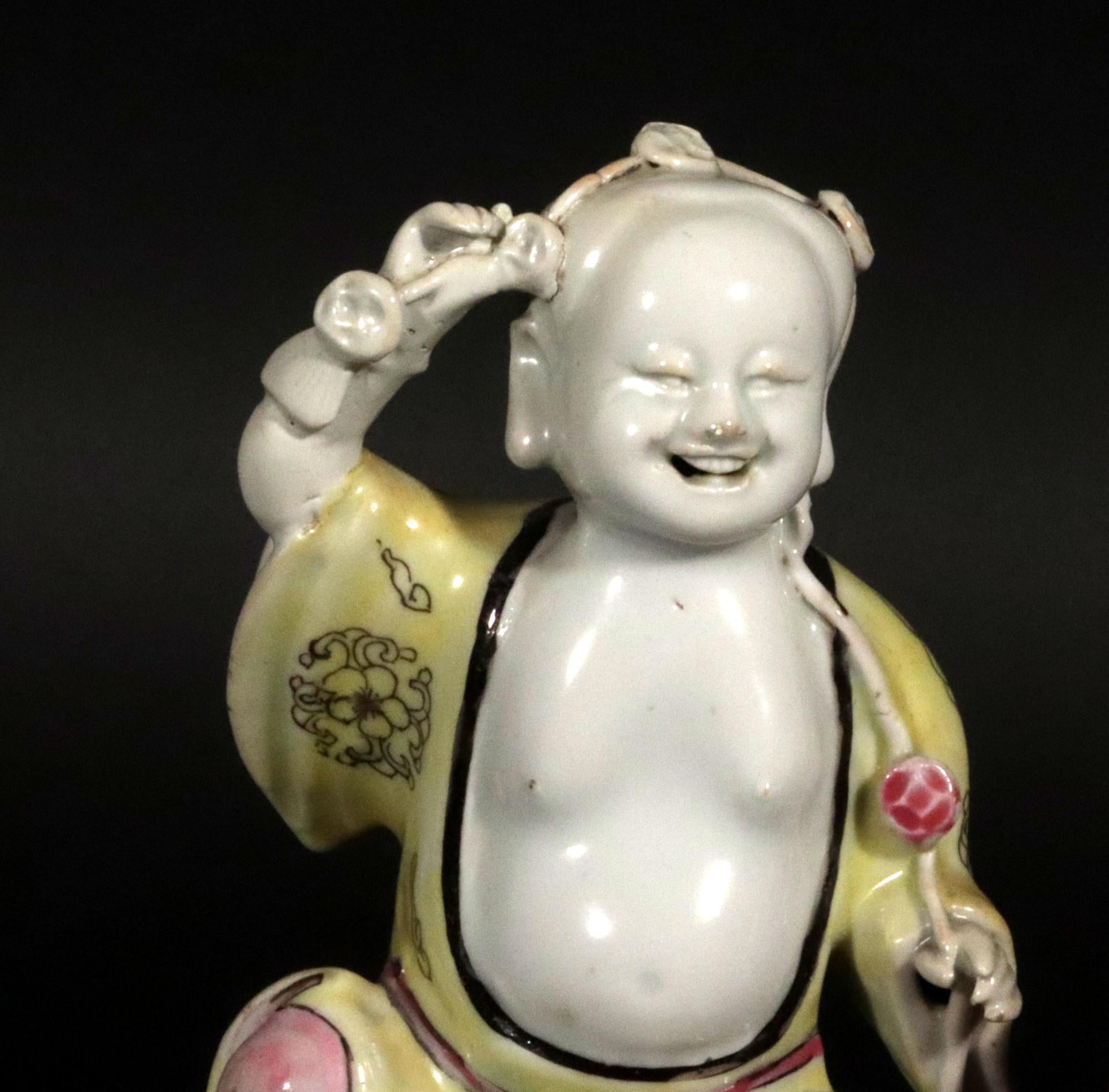 Chinese Export Porcelain famille rose Fire Group Representing the Hehe Erxian. 
Harmony & Joy,
Qianlong period,
Circa 1770-80.

The Chinese Export porcelain figure group is decorated in the famille rose palette, with two boys seated on pierced rock