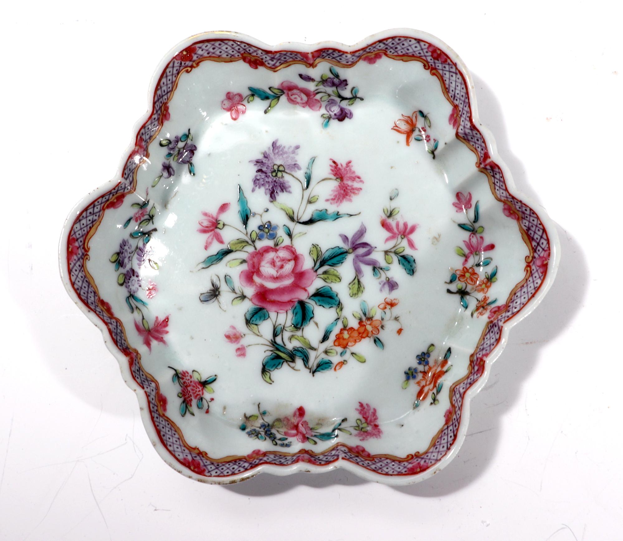 Chinese Export porcelain famille rose botanical teapot stand,
circa 1775

The attractive Chinese Export porcelain teapot stand is of hexagonal form with raised shaped sides. The center depicts a large groupings of famille rose flowers and leaves