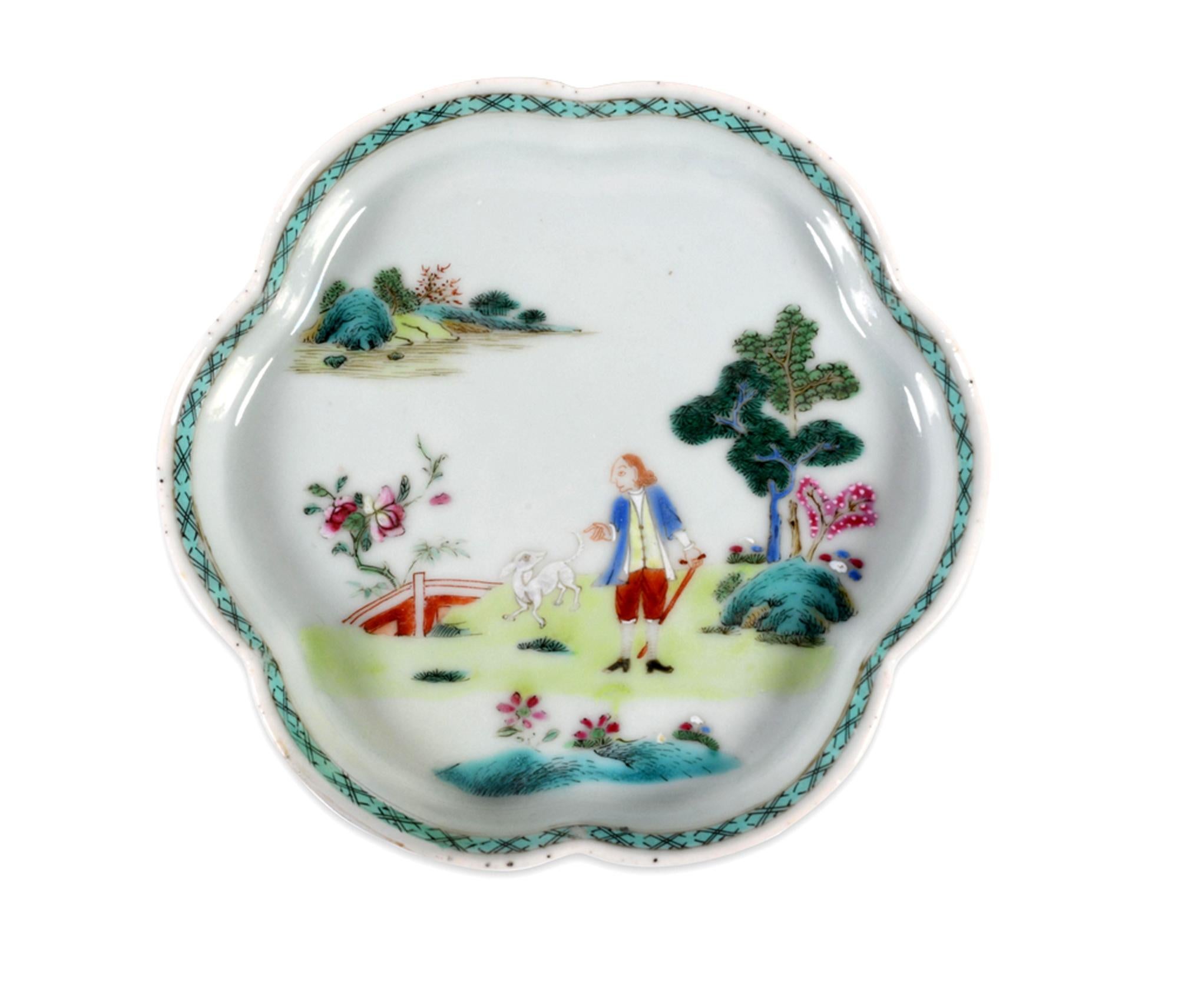 Chinese Export Porcelain Famille Rose Teapot Stand,
European Man and Dog,
Circa 1740-50

The charming shaped porcelain stand depicts an European subject scene of a figure of a European man standing with a small white dog on a grassy patch in a