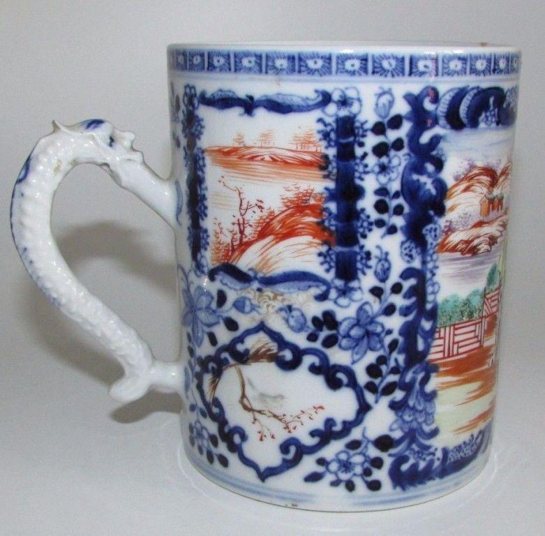 Fine Chinese porcelain Famille Rose Mandarin Tankard mug of impressive size. 

Hand decorated in brightly colored enamels featuring a large panel to front depicting a Chinese Family with other smaller panels on a blue and white ground. Applied