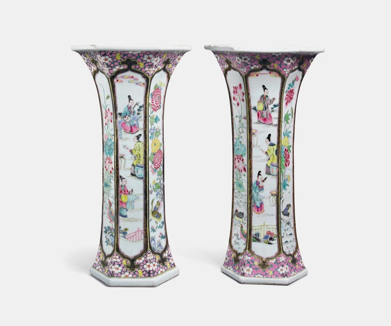 Chinese Export porcelain Famille rose beaker vases,
Yongzheng Period,
Circa 1730-35

The Chinese Export porcelain vases are of hexagonal form with a tall, waisted body, each panel painted with a shaped cartouche enclosing either a scene of