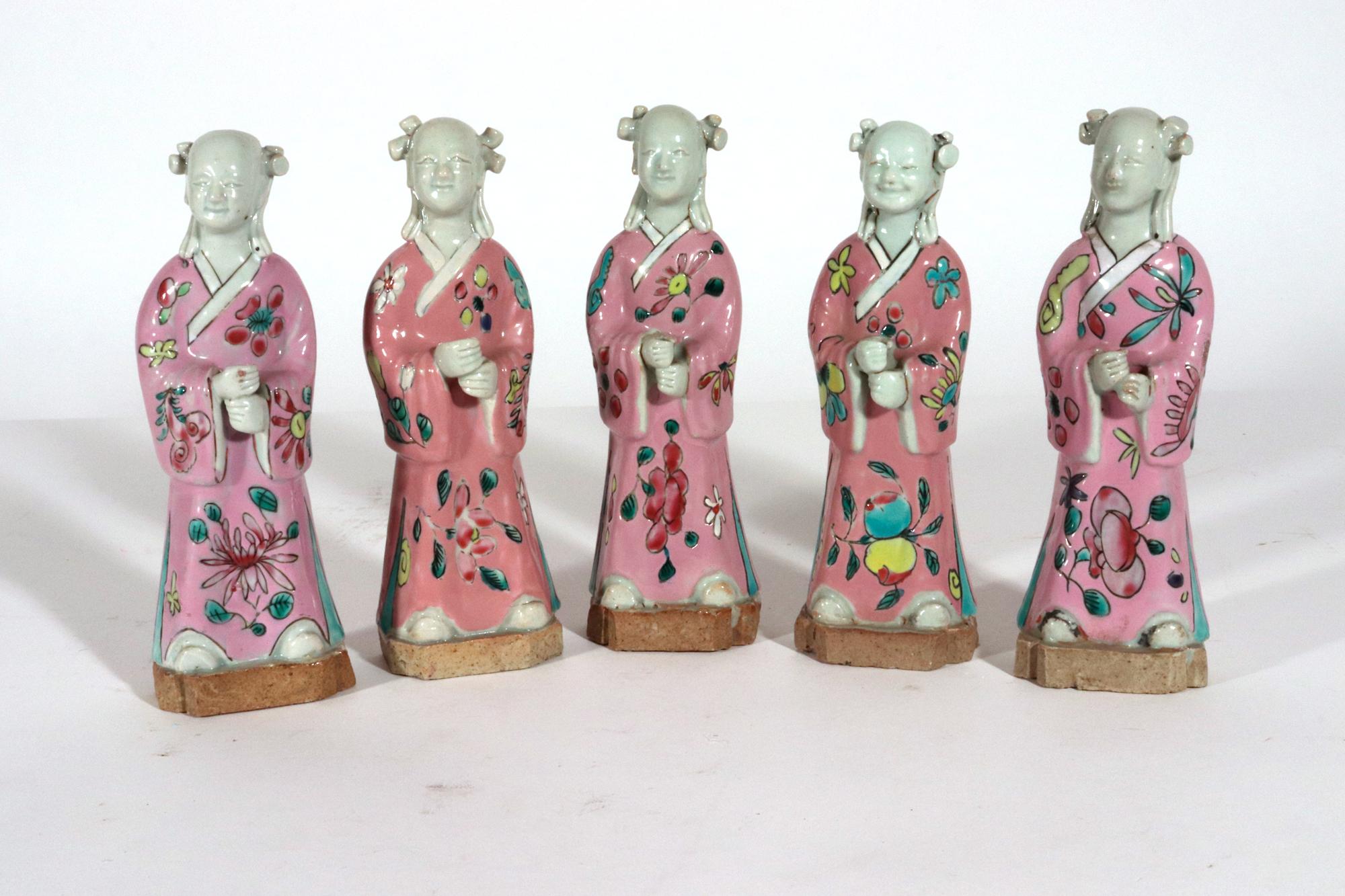 Chinese Export Porcelain Figures of Attendants,
Set of Five,
Circa 1780

The set of five Chinese Export porcelain figures are painted in famille rose enamels with a purple robe and stand on an unglazed base.

Dimensions: 6 1/4 inches tall x 2 1/4