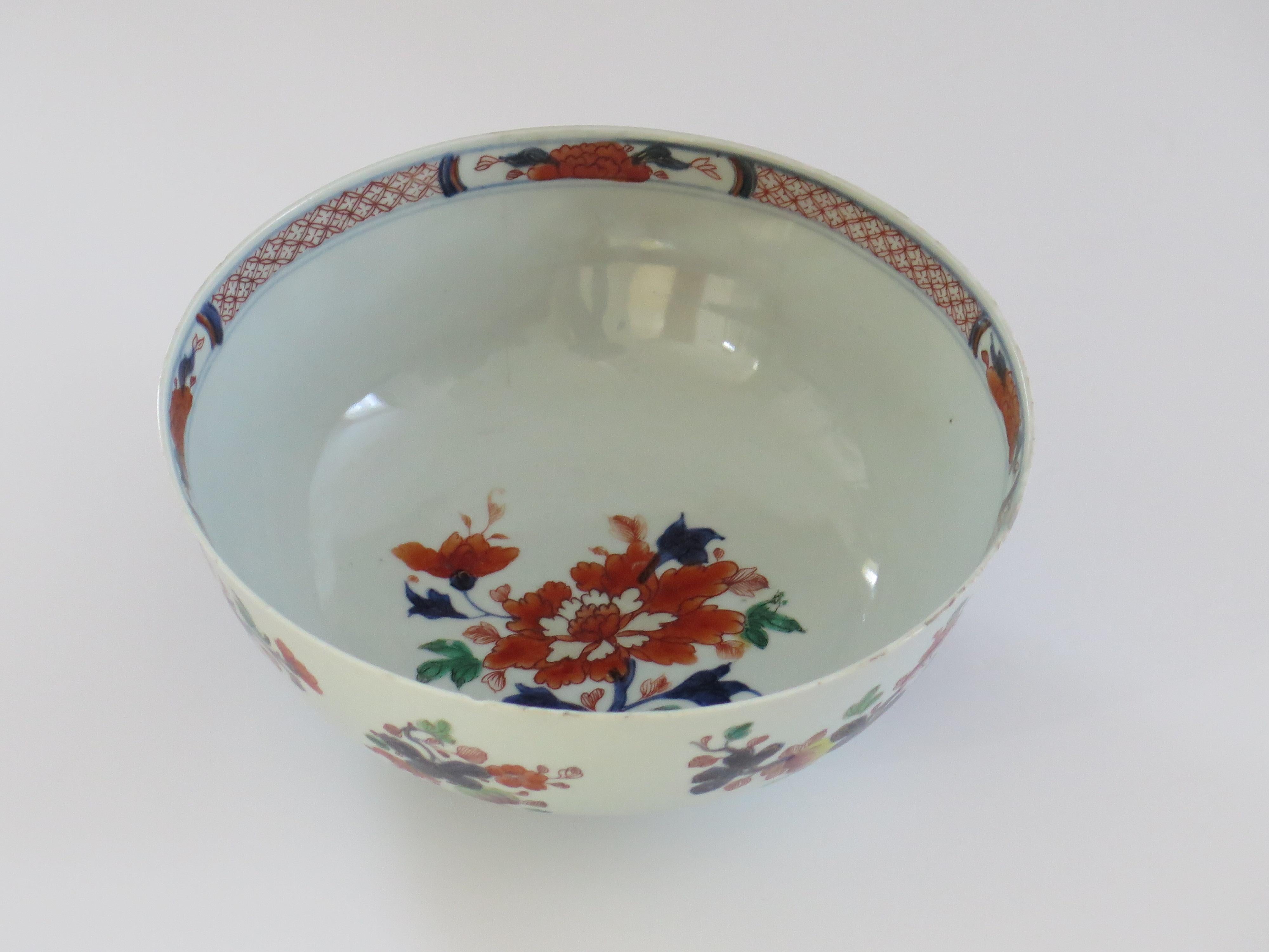 This is a beautifully hand painted large Chinese export bowl from the mid 18th century, Qing dynasty, Qianlong period, 1736-1795. We date this piece to circa 1750.

The bowl is well potted on mid height foot, all made from a very white