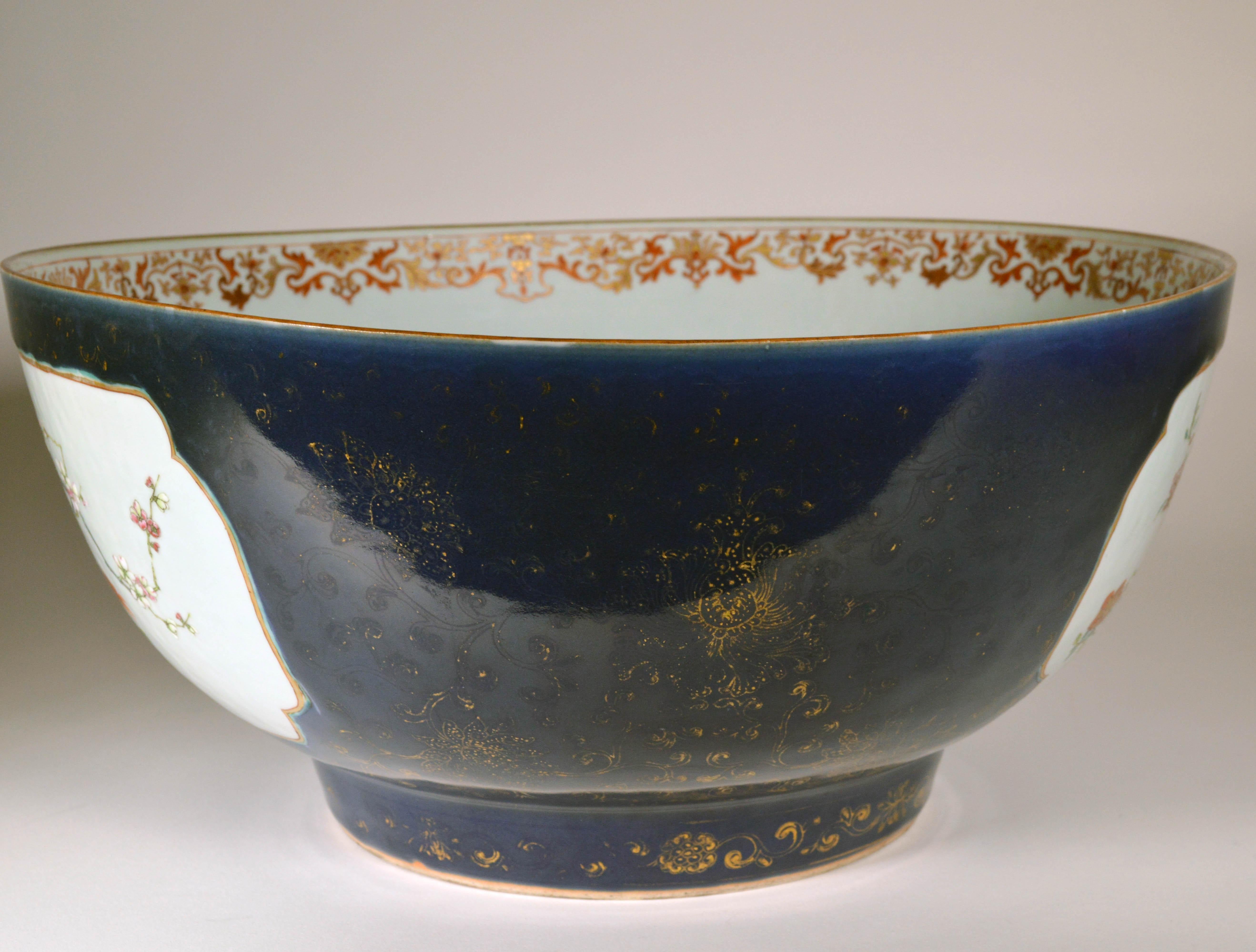 Chinese Export Porcelain large “Famille Rose” punch bowl with mazarine blue and gilt ground, 
circa 1760-1970
  

The large Chinese Export punch bowl is finely painted on the interior with “famille rose” plants and flowers and a wide rococo