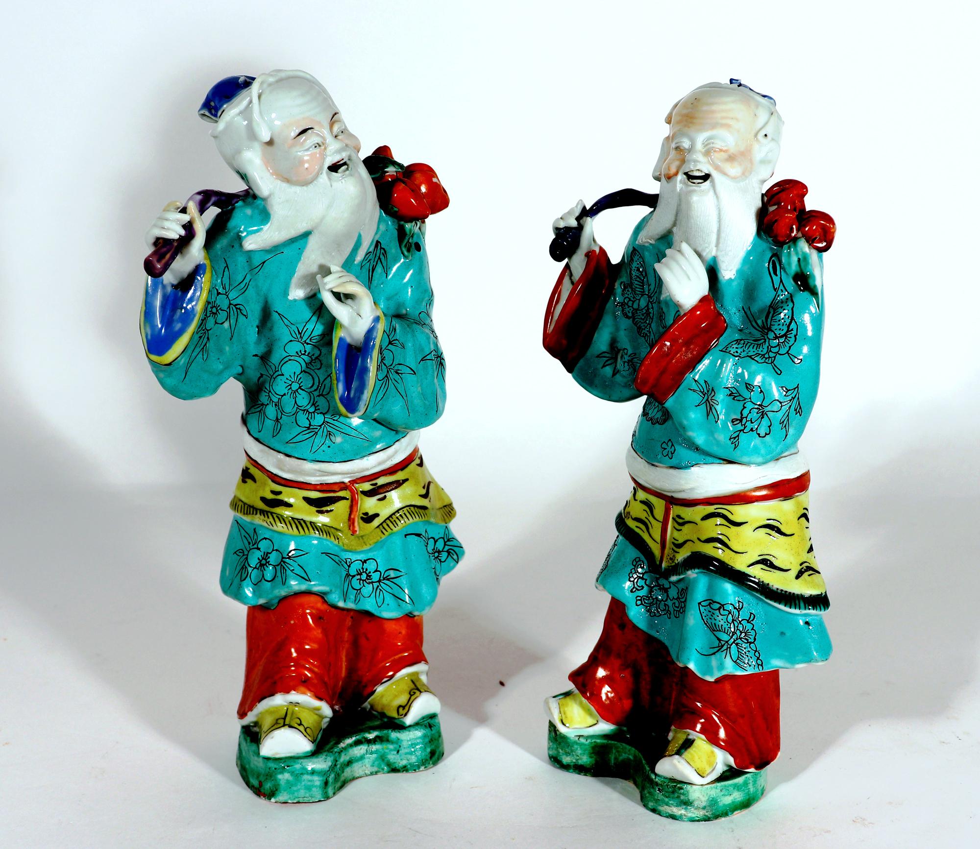 Chinese export porcelain large mythical figures,
Probably of Shouxing, God of Longevity
Circa 1775

The two Chinese Export figures stand on green shaped bases and although they are the same subject, they are modeled differently. They have a long