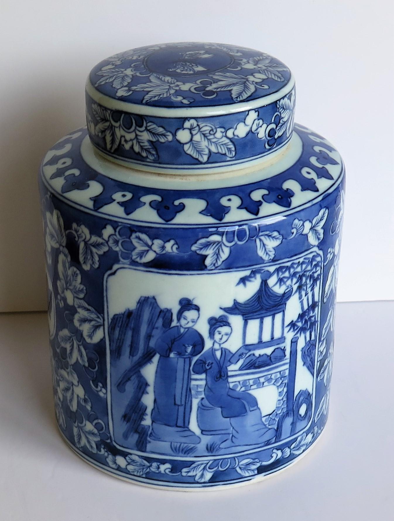 This is a good Chinese porcelain lidded jar or pot, hand painted in a blue and white people pattern, which we date to the mid-20th century, circa 1940.

The jar is cylindrical with straight sides and a matching lid, with a total unpacked weight of