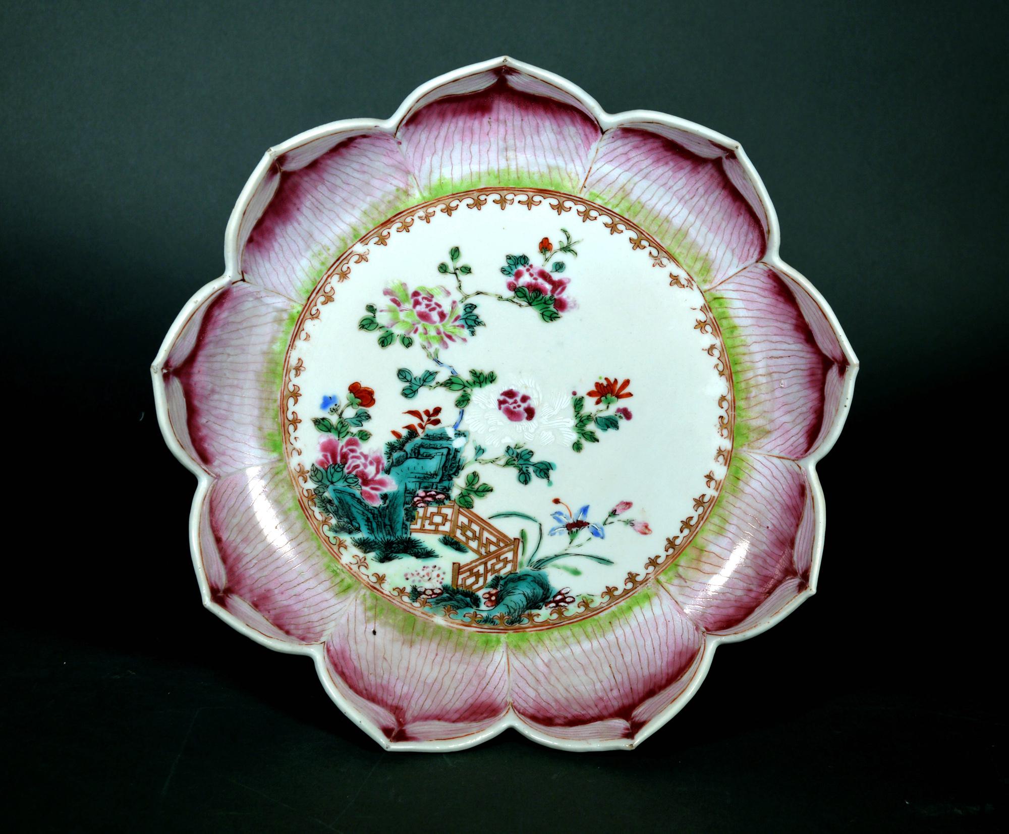 Chinese Export Porcelain Lotus Leaf Shaped Dish,
Circa 1765

The large Chinese Export “famille rose” porcelain saucer dish is made in the form of a lotus leaf with the rim and border in the form of nine different lotus leaf petals in shades of pink