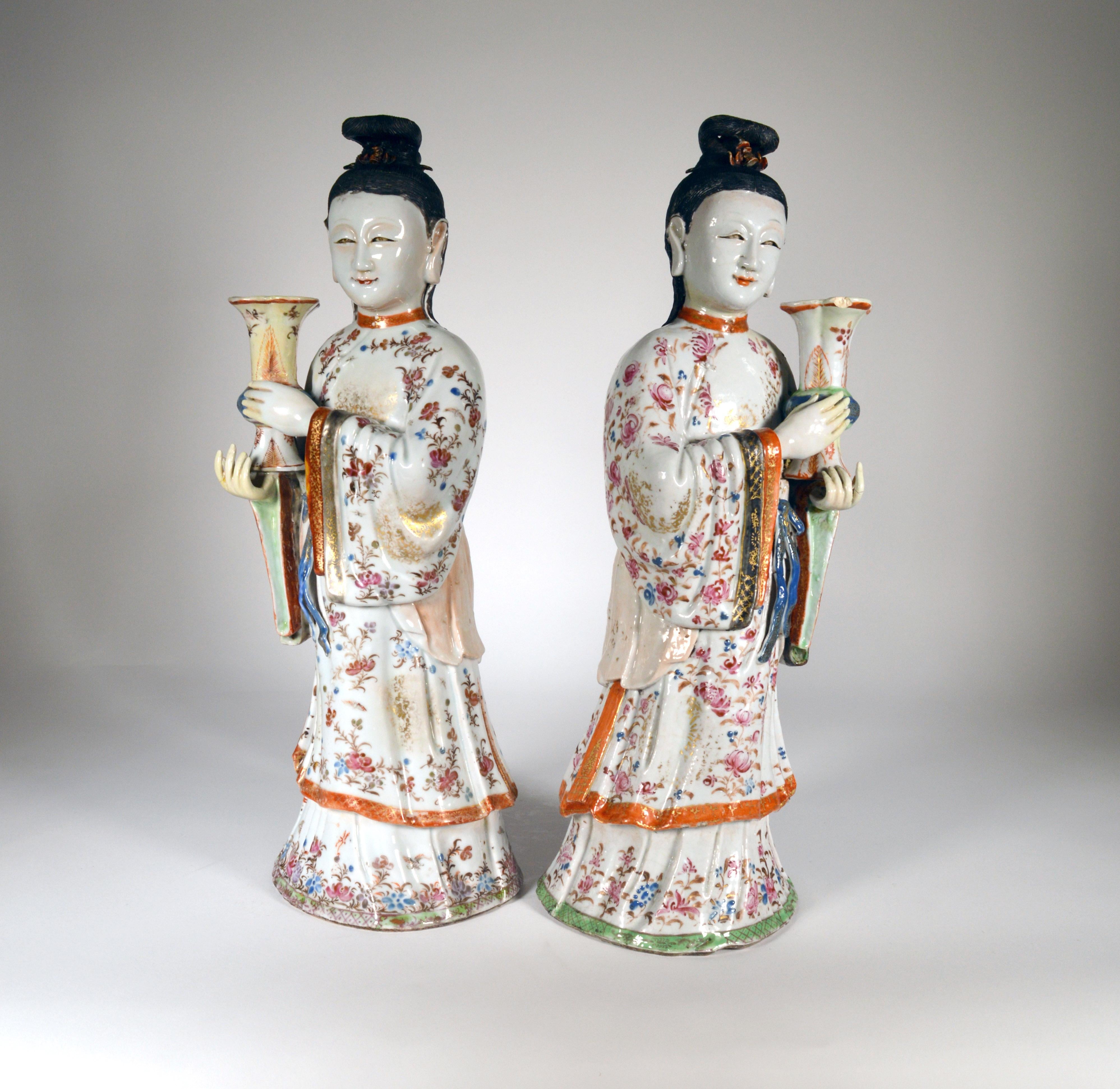 Chinese Export Porcelain pair of maiden candlesticks, 
circa 1760-1775 
   

A pair of large Chinese Export figures of standing maidens holding gu form vases as candle sconces, in “Famille Rose” enamels with robes painted with gilt and “Famille