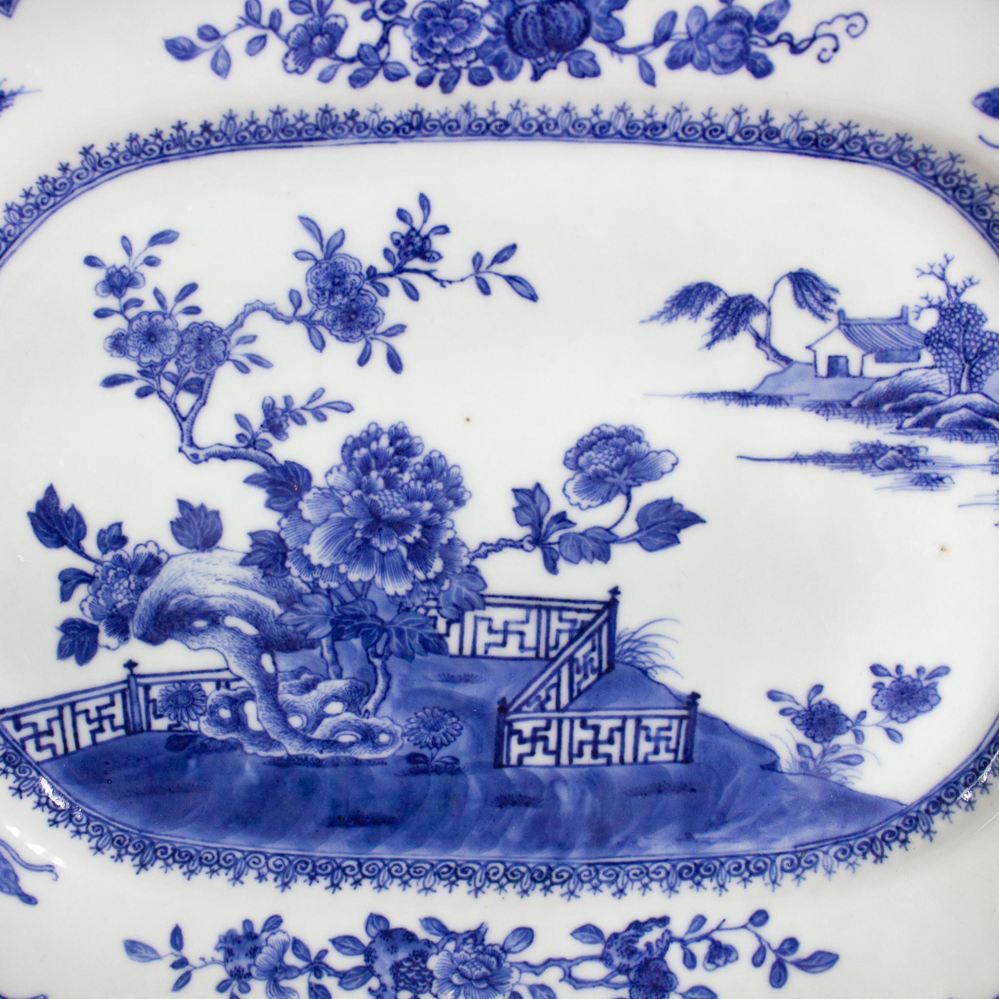 A Chinese Porcelain pair of octogonal platters, East India Company, Qing Dynasty (1644-1912), Qianlong Period (1736-1795). The rim is decorated with underglaze blue depicting floral motifs, butterflies and grasshoppers, emblems of bliss, summer and