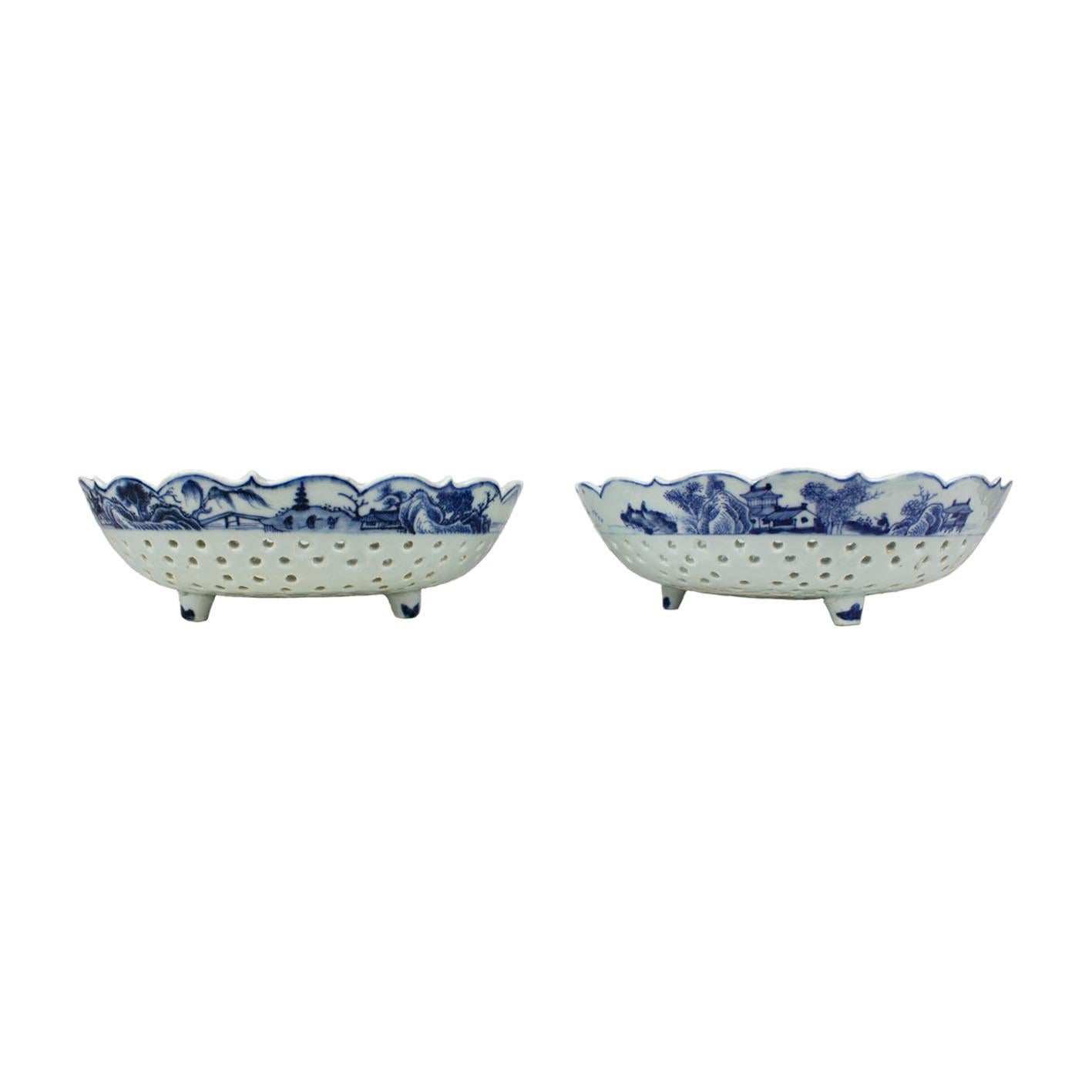 A pair of Chinese porcelain strawberry bowls, East India Company, Qianlong period (1736-1795). Underglaze blue decoration with vegetal motifs on the scalloped rim. These bowls were used to drain water from the strawberries after being washed.