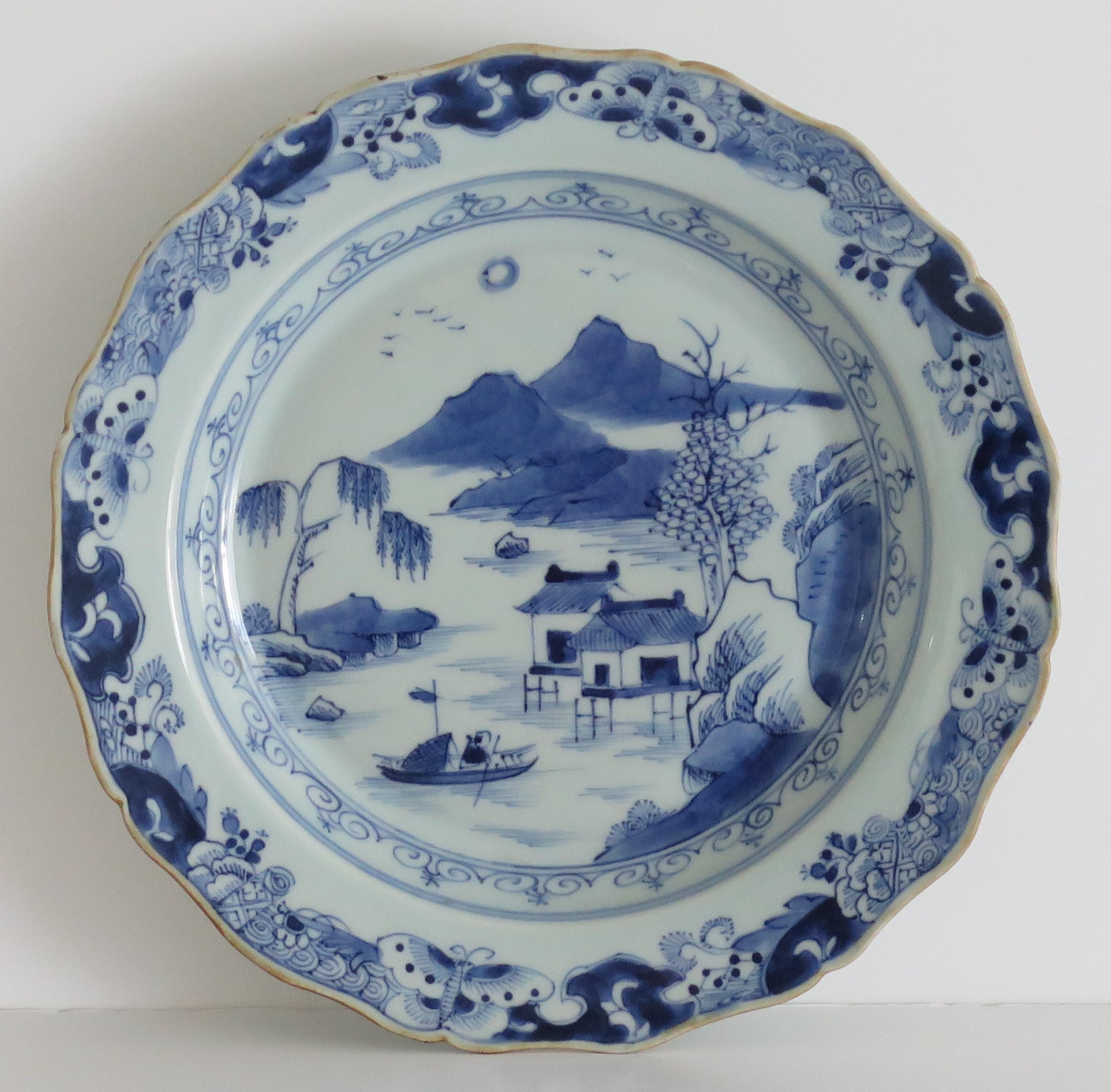 This is a very good Chinese porcelain plate, all hand painted in a Blue and white pattern, made for the export (Canton) market, during the second half of the 18th century.

The plate is circular and well potted with a nice scalloped edge and