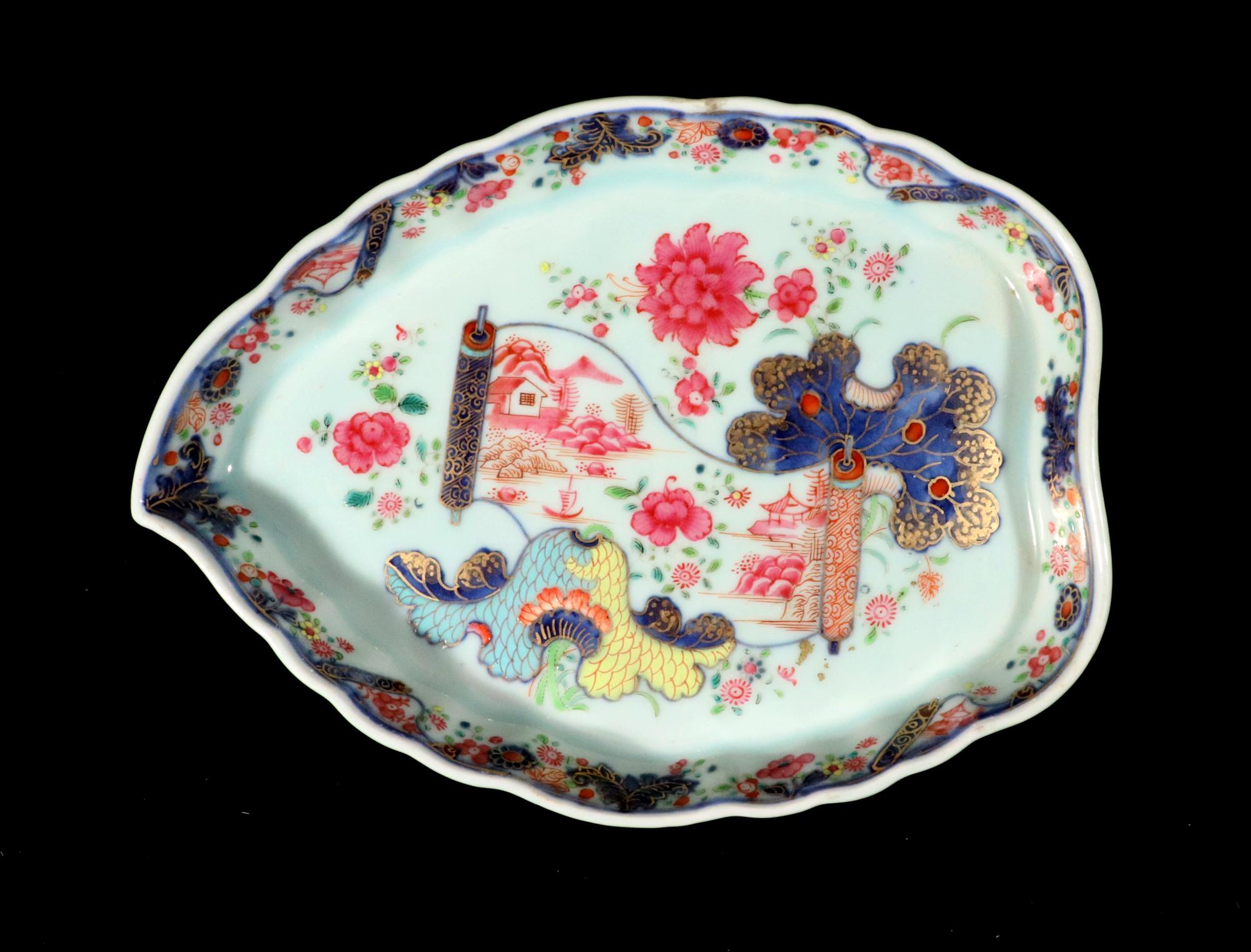 Chinese Export Porcelain Pseudo Tobacco Leaf Shaped Dish,
Circa 1765

The Chinese Export porcelain shaped dish.  The leaf-shaped dish is in a rare pattern.  The leaves in a tobacco leaf color with the center with an unfolding scroll depicting a