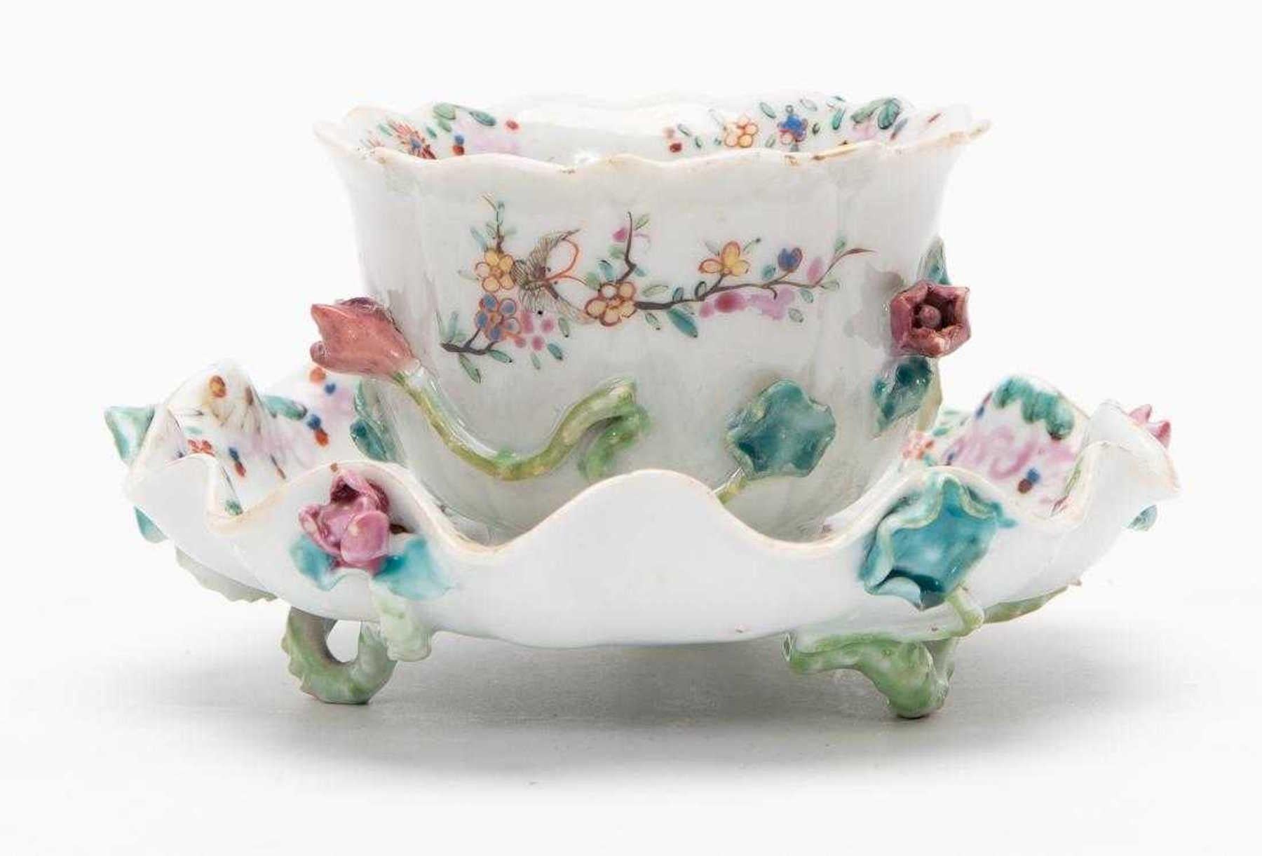 Chinese export porcelain Qianlong rare lotus cup and saucer, Realistically modeled with applied flowers and vines, painted with butterflies and flowers. 
Provenance: With H. Moog, Atlanta.
  