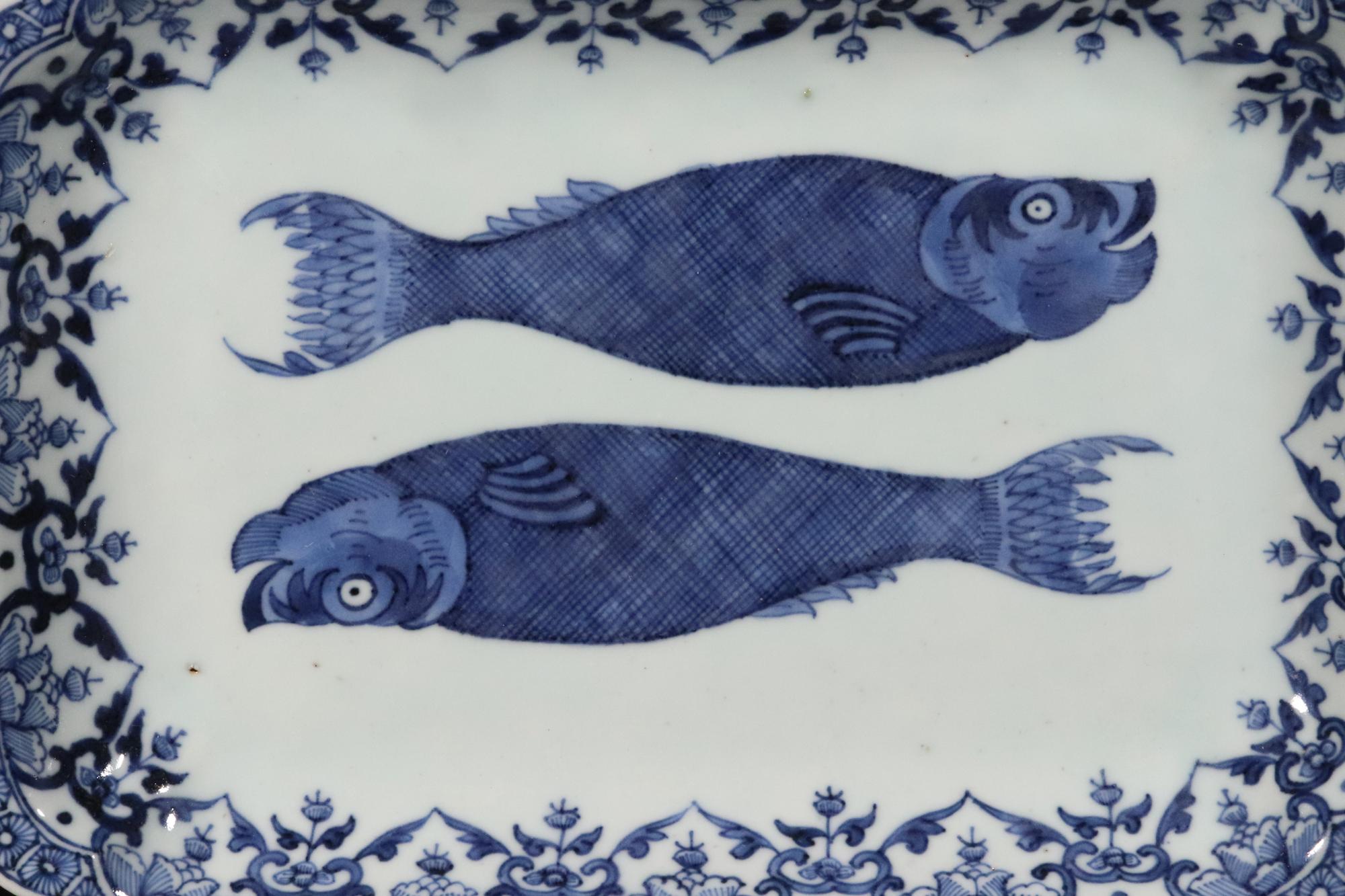 Chinese Export porcelain rare blue & white double herring dish,
Circa 1765

The rectangular Chinese Export underglaze blue and white dish of rare large size is painted with two herrings, each facing a different way with an elaborate bordered edge