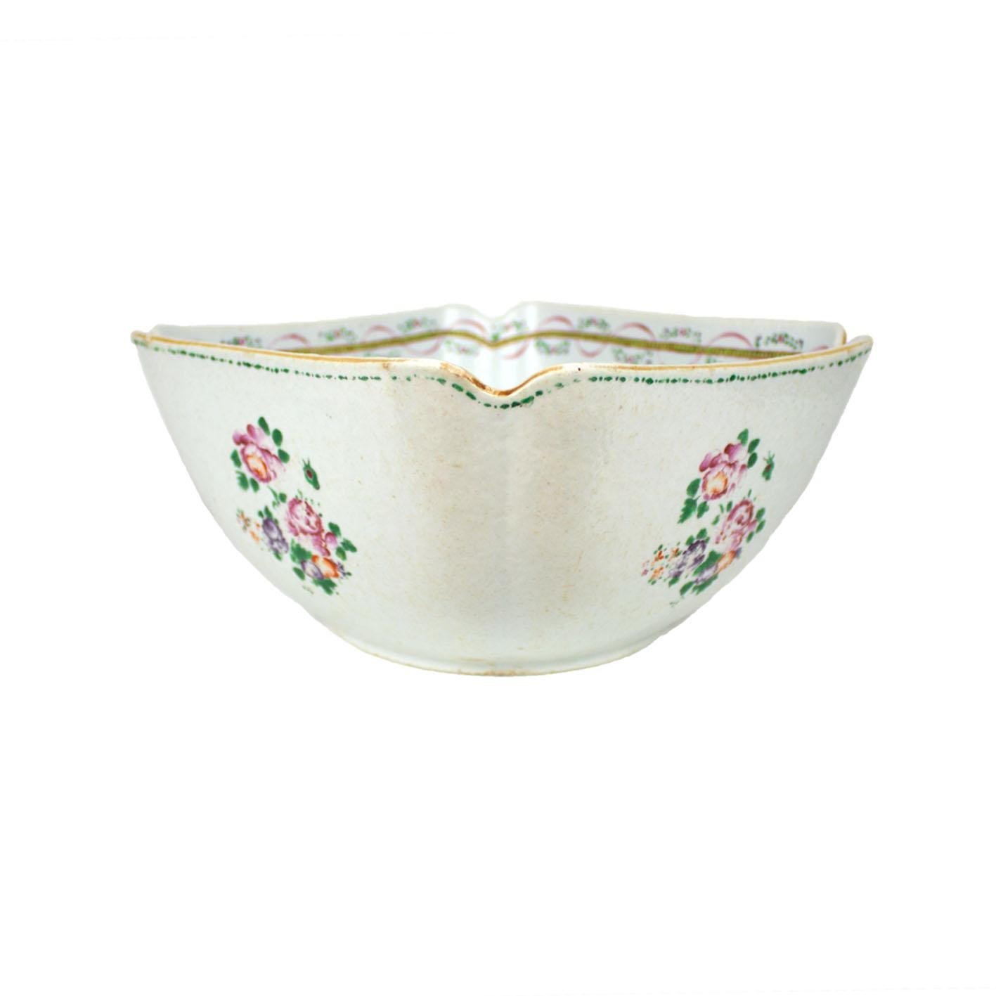 A Chinese porcelain square scalloped bowl with orange peel texture, East India Company, Qianlong Period (1736-1795). Polychrome Famille Rose decoration representing floral motifs. The inside frieze is decorated with ribbons and garlands of flowers.