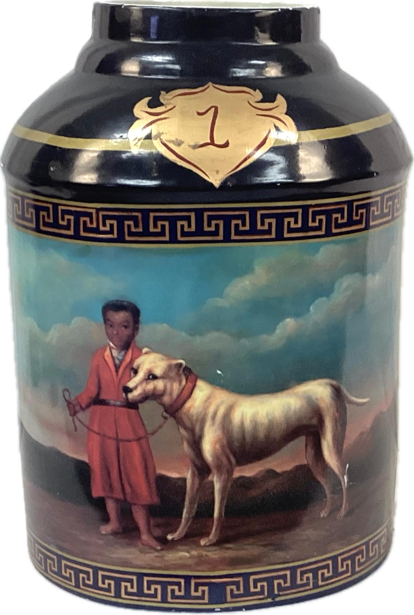 Chinese Export hand-painted porcelain tea caddy jar. Pictures of a boy and his dog adorn both sides of jar in rich colors of dark blue, gold, red and turquoise. Greek key border frames the scene. This type of jar may have been used to retail tea in