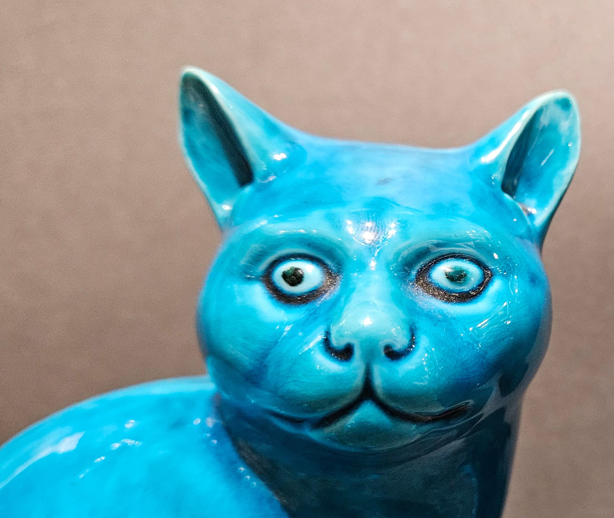 Chinese Export Porcelain Turquoise Pair of Cats,
Early 20th Century

The porcelain Chinese porcelain cats are a facing pair with a turquoise color ground sitting in as recumbent position with their tails curly upwards.

Dimensions: 4 inches high x 5