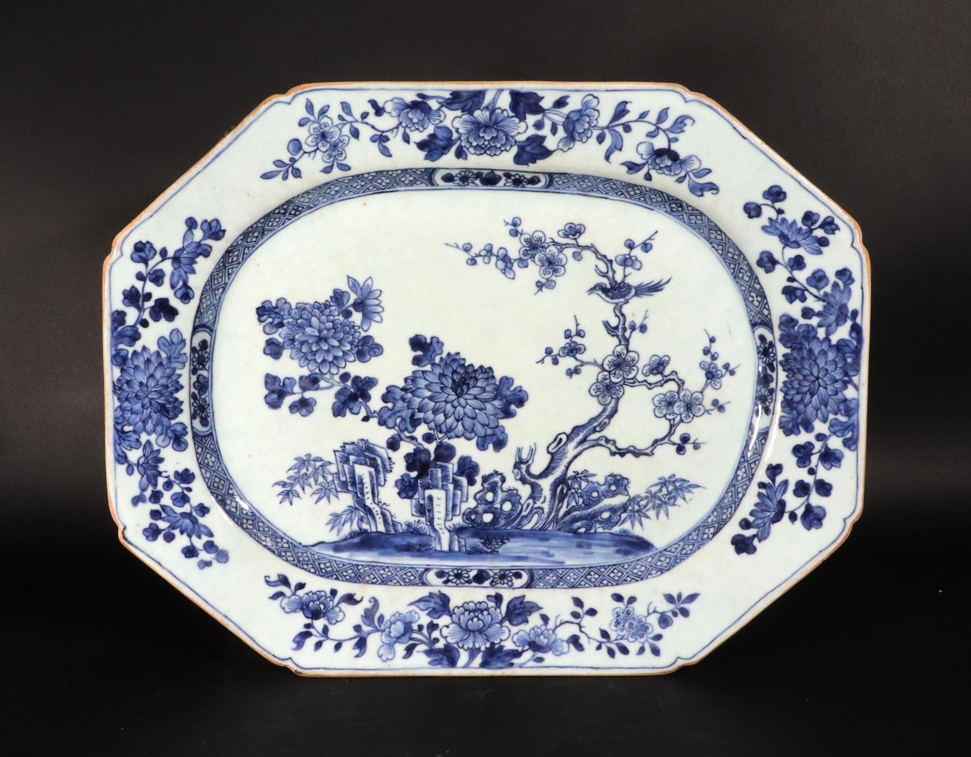 Chinese Export Underglaze Porcelain Rectangular Dish
Circa 1765

The Chinese Export underglaze Blue rectangular dish with canted corners has a well-painted central well with a tree, plants, and flowers issuing from a rock formation.  A large bird