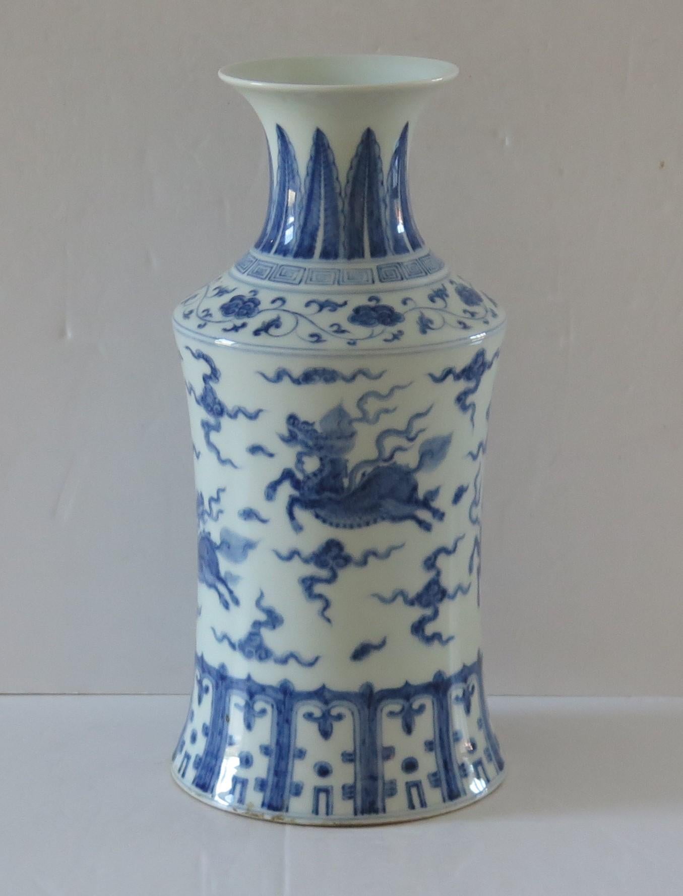 This is a beautiful mid-size Chinese Export, blue and white, porcelain vase, which we date to the first half of the 20th Century, Circa 1930.

This is a well potted piece with a baluster-rouleau shape, having a concave body, tall neck and everted