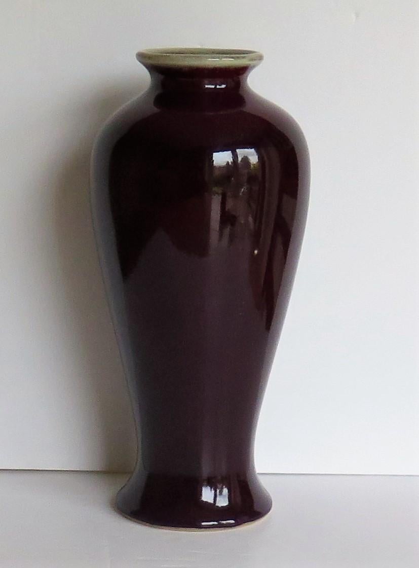 This is a very decorative Chinese Export vase or jar with a monochrome ox blood red 