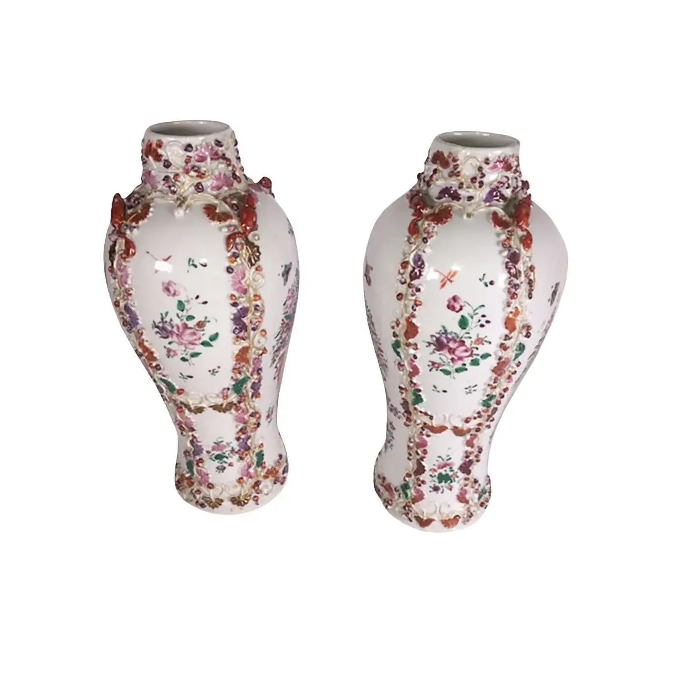 A pair of Chinese export porcelain vases with mice surrounding the top. Vases also with an urn, flowers and butterflies, circa 1780-1800.