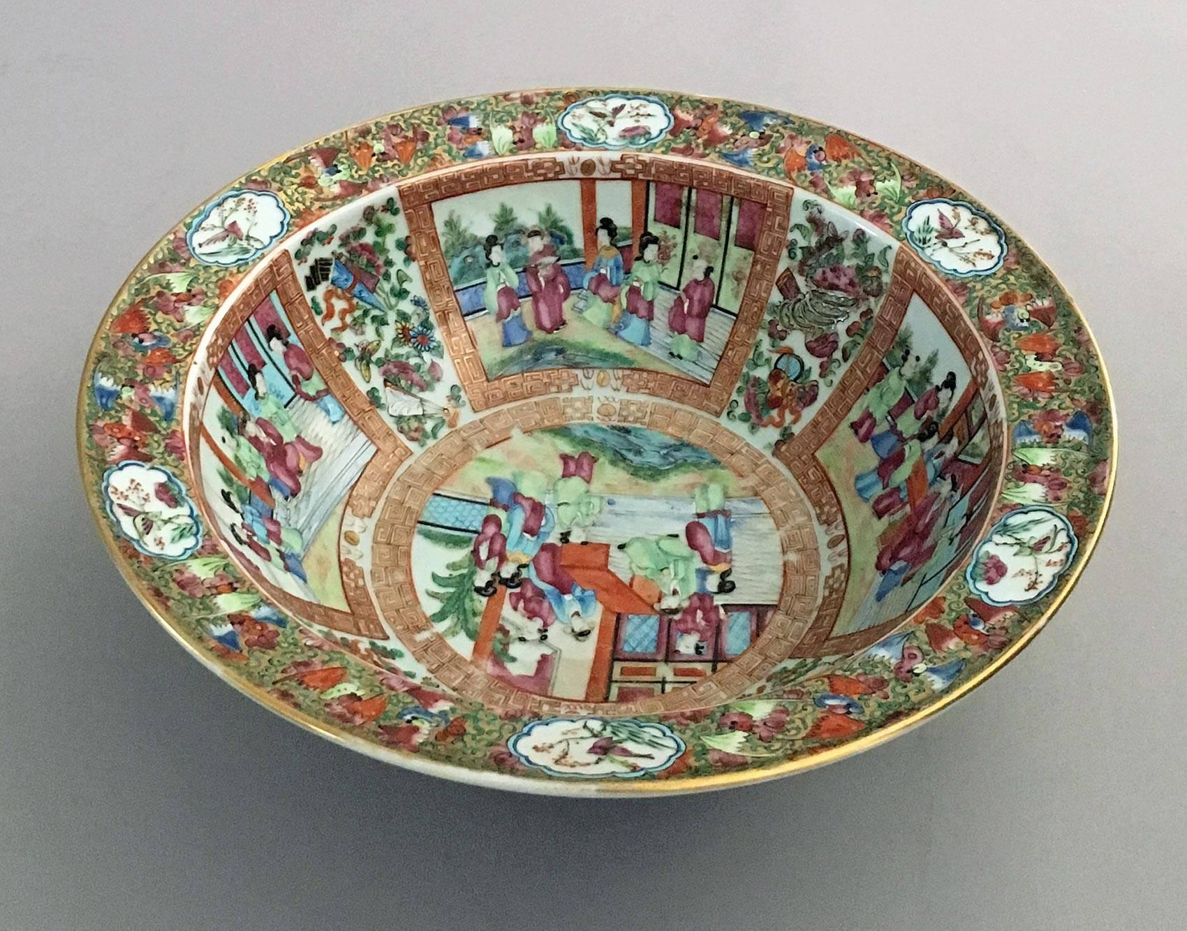 Chinese large Qing dynasty, Famille Rose porcelain bowl with flat 1.50? rim, the interior of the bowl is decorated with four trapezoid-shaped panels edged with red and gilded Greek key patterns which enclose palace scenes, the centre medallion also