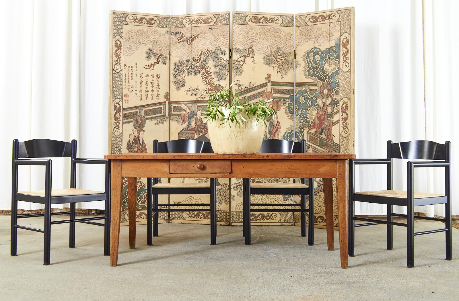 Gorgeous Chinese export late Qing four panel coromandel screen featuring rare ivory colored lacquered panels incised with color pigments. The screen depicts an official with his attendants and court ladies under a pine tree in a fenced garden.