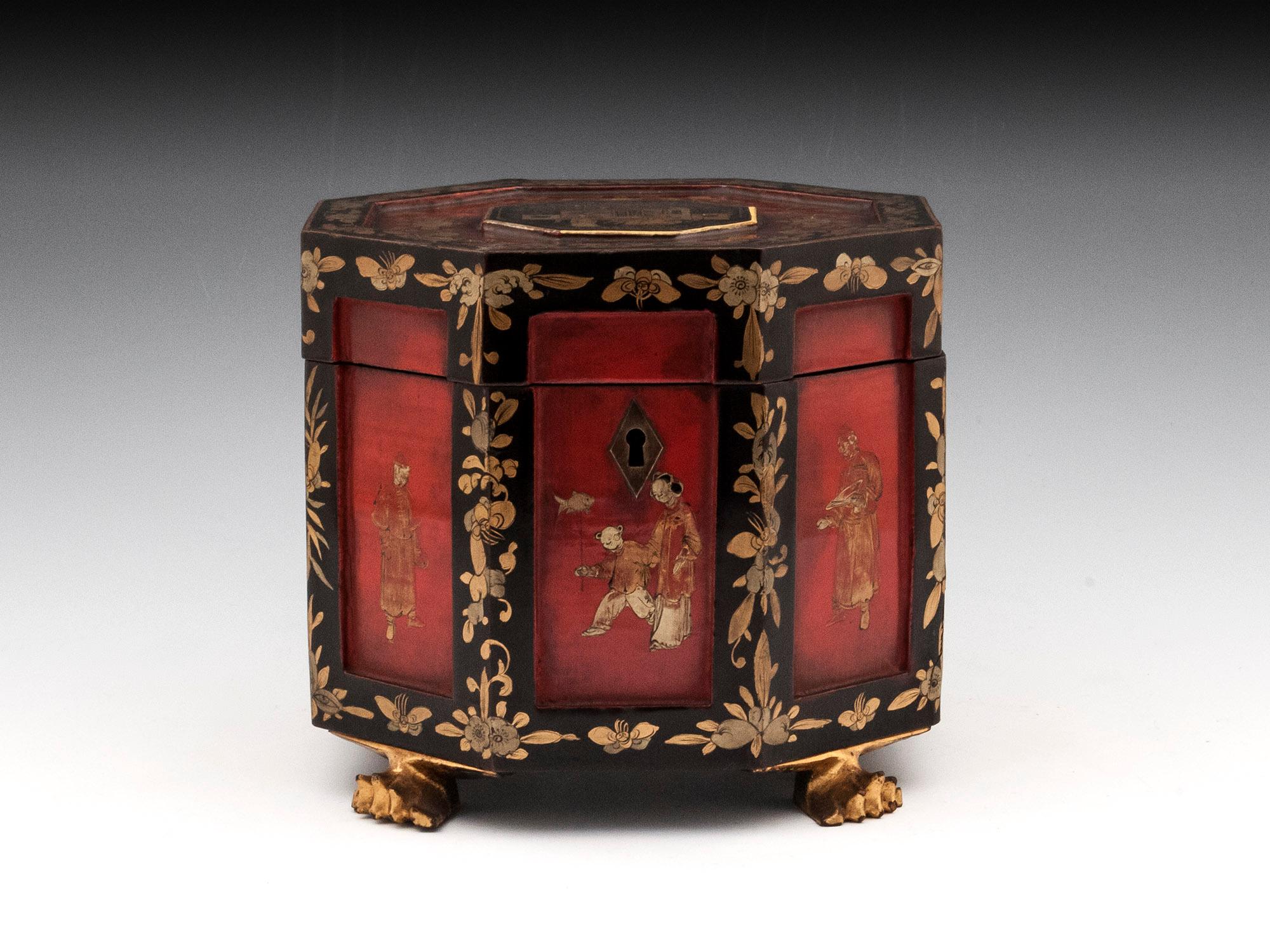 A rare Chinese export lacquer tea chest, with beautiful red panels decorated with Chinese figures which are framed with gold floral black lacquer borders. Contains a removable, decoratively engraved Paktong tea caddy. The bird-engraved removable lid