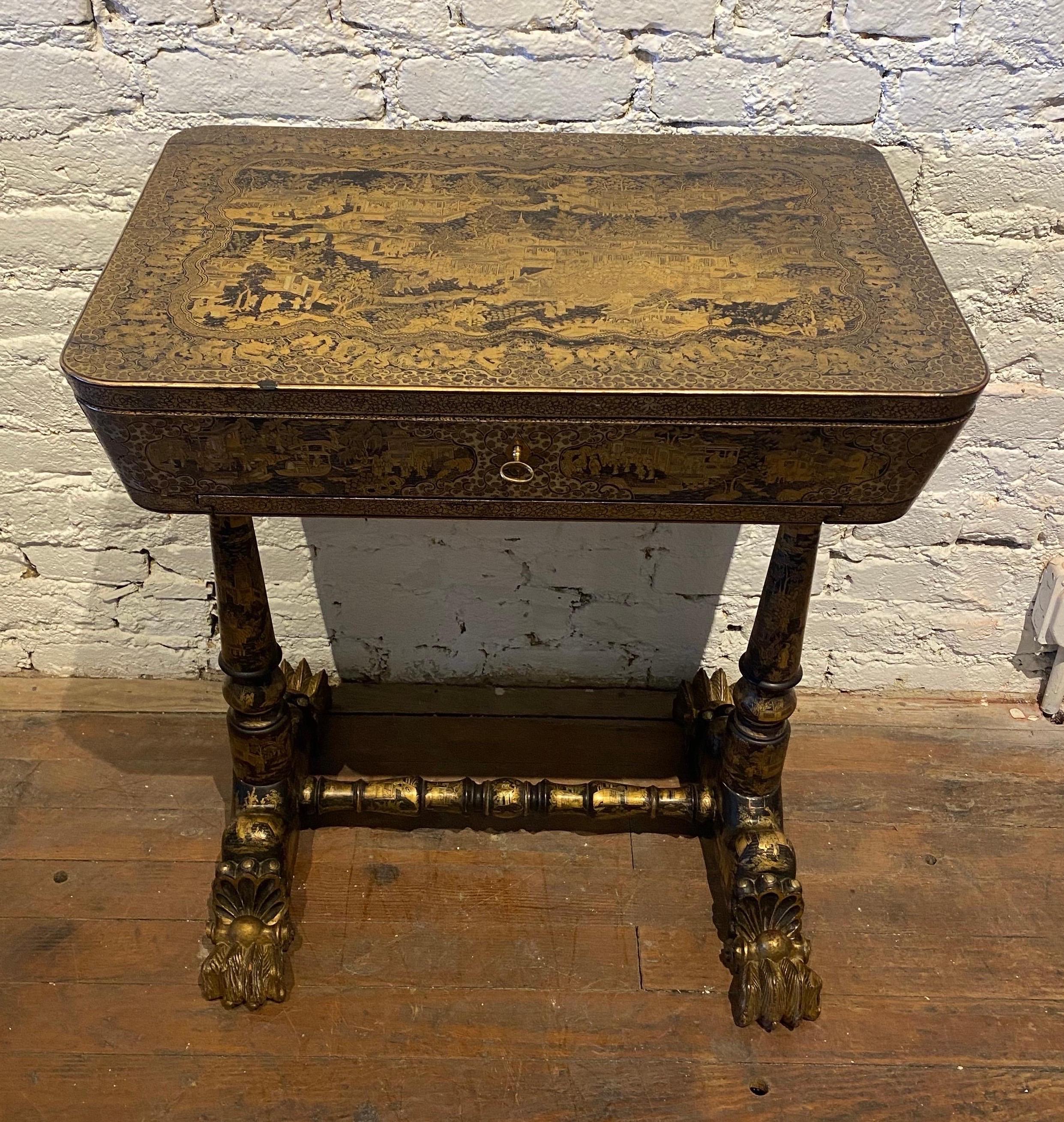Very good Chinese export sewing table with removable trays and bone sewing tools/spools. Remarkable condition original lacquer work chinoiserie table with all the bells and whistles.