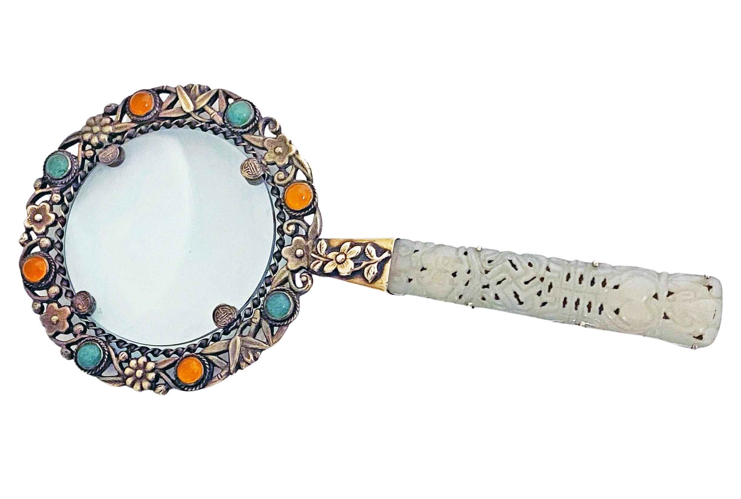 Rare Chinese Export Silver and Jade Magnifying Glass, C.1890. The pierced foliate silver frame bezel set with four green jadeites and four orange carnelian, the handle on one side with engraved silver foliate decoration, traces of original gilding