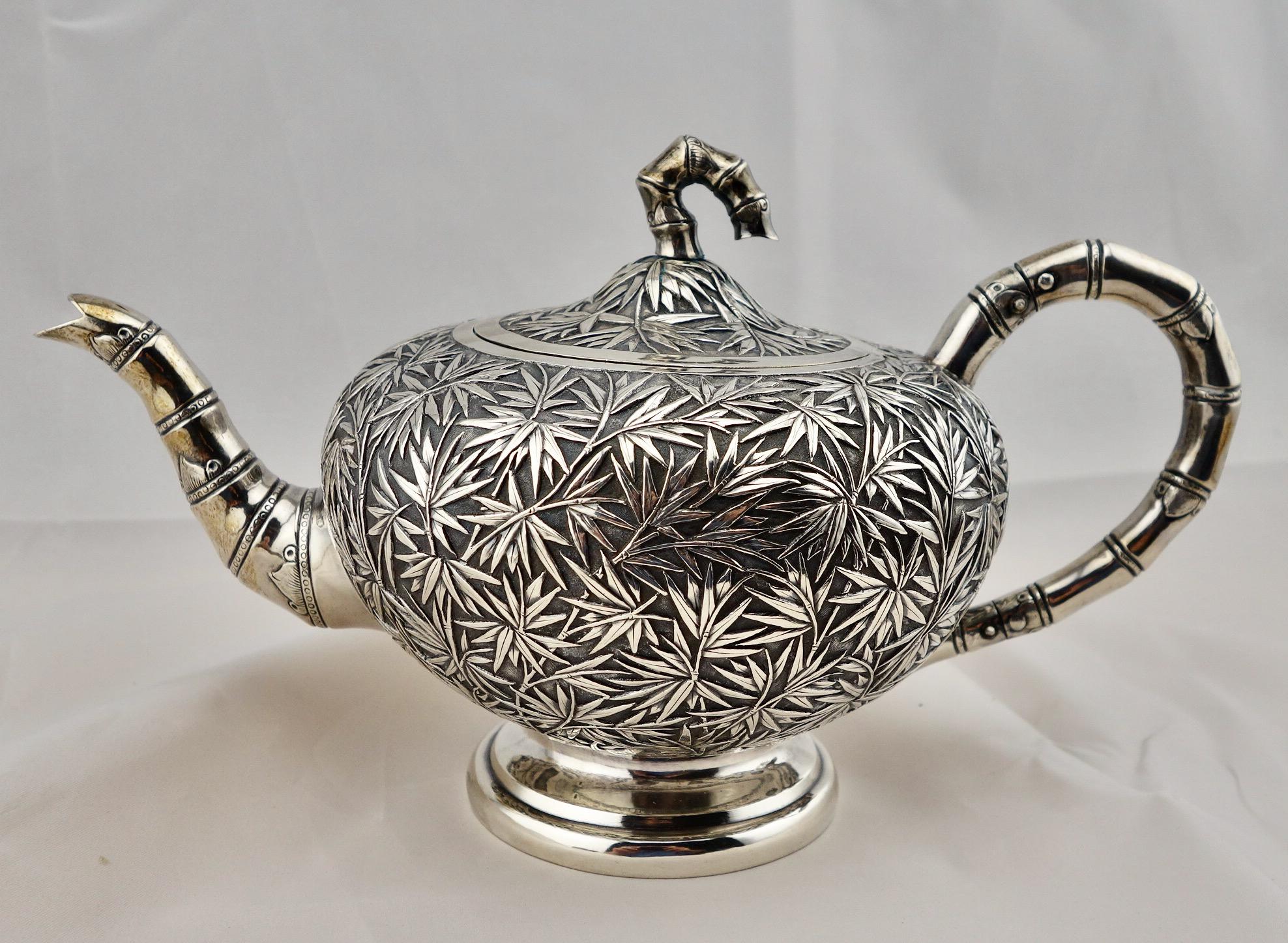 Chinese export bamboo pattern silver 5-piece tea service, circa 1860-1880. The teapot, covered sugar, creamer and waste bowl marked 