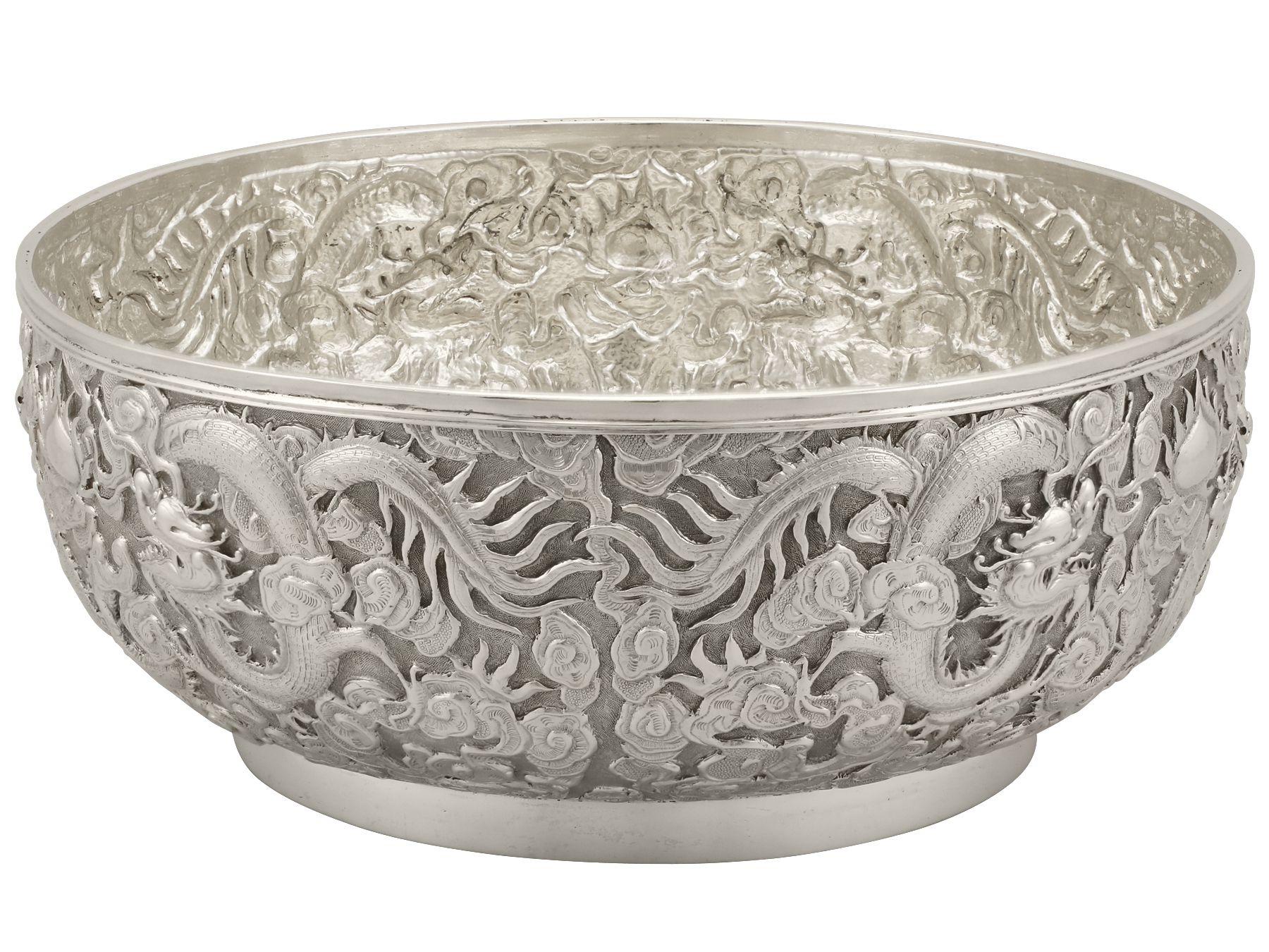An exceptional, fine and impressive antique Chinese Export silver bowl; an addition to our Chinese/Asian silverware collection

This impressive Chinese Export Silver (CES) bowl has a plain circular form onto a plain collet foot.

The body of this