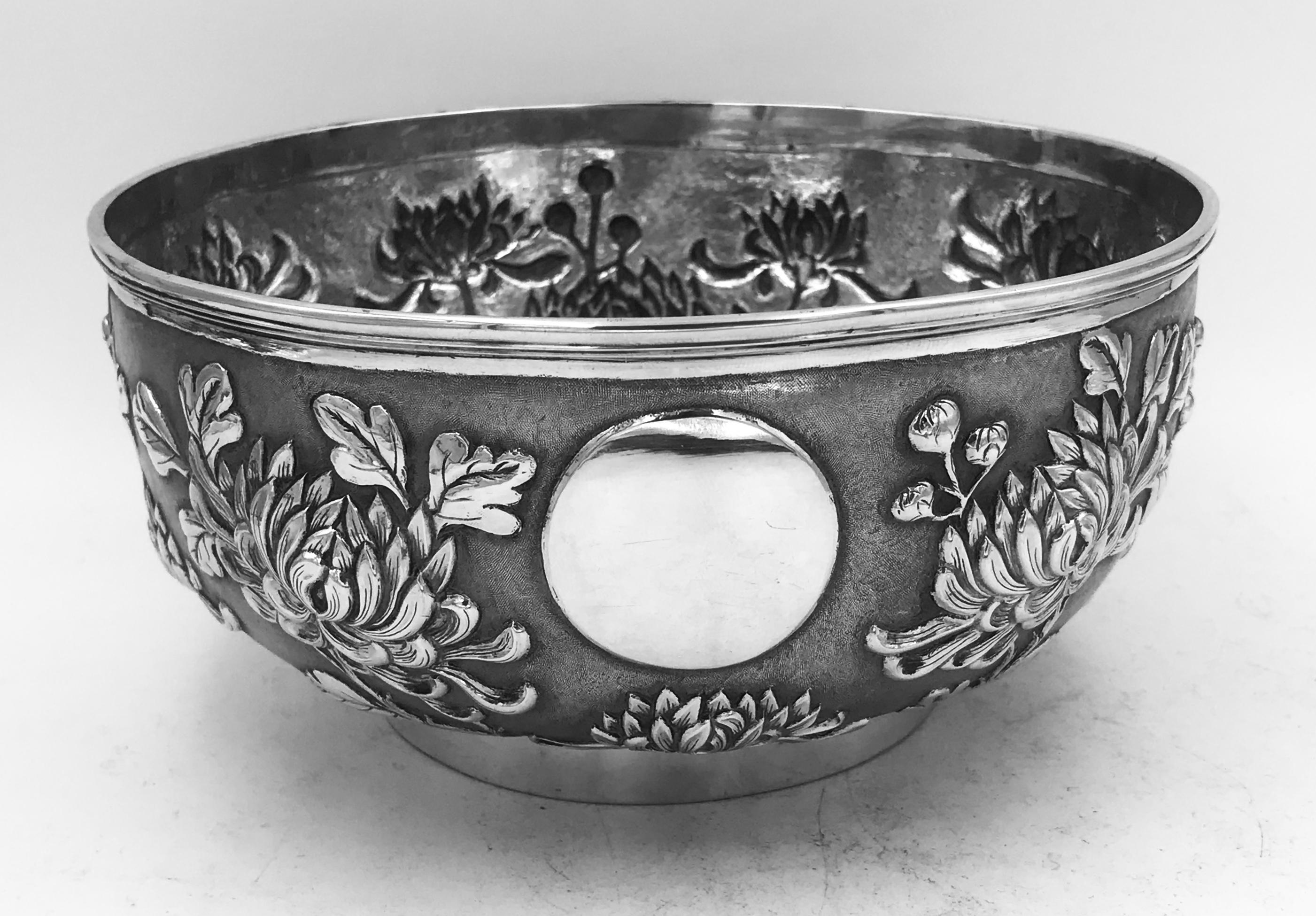 A Chinese Export silver bowl decorated with chrysanthemum against a matte background.
Made by the firm of Lian xiang sheng of Shanghai and Canton, and retailed by Hung Chong.