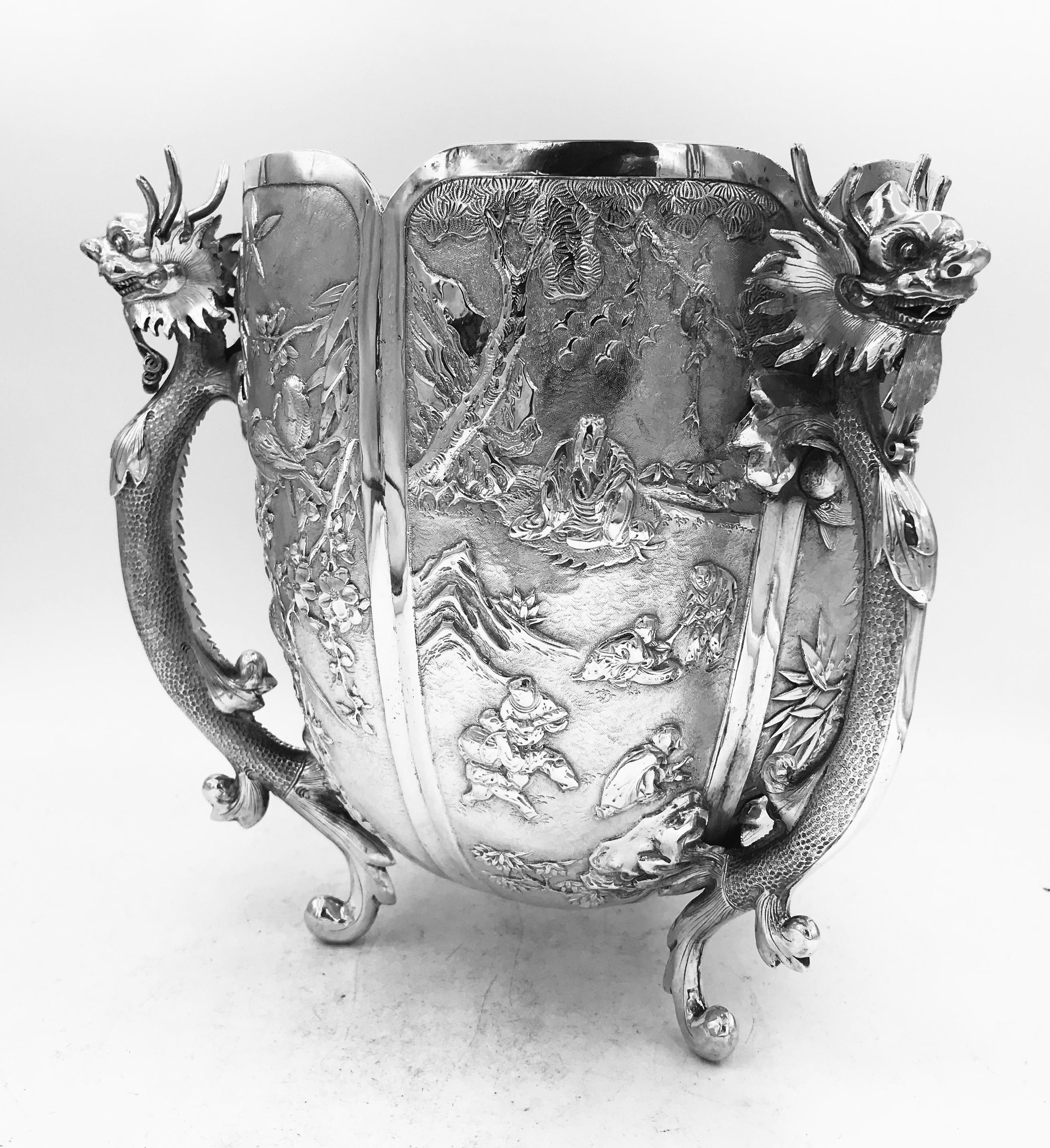 A Chinese silver bowl of variously decorated hexafoil form standing on three dragon supports. The bowl, which weighs 915gm, was sold by the well known and influential firm of Wang Hing circa 1885. Wang Hing had premises in Canton, Shanghai, and Hong