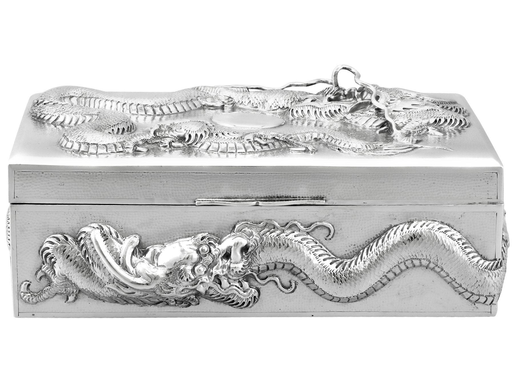 An exceptional, fine and impressive antique Chinese Export silver box; an addition to our collection of boxes and cases.

This exceptional antique Chinese Export Silver (CES) cigarette box has a plain rectangular form.

The surface of the body