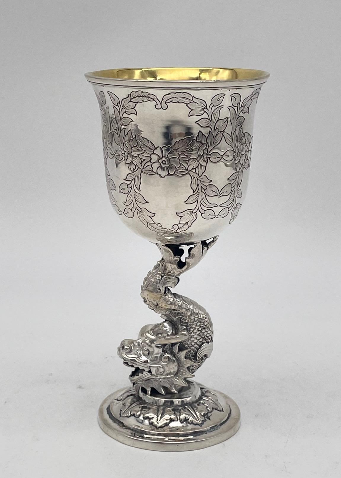 A Chinese Export Silver Goblet with dragon stem, engraved foliage to the bowl, and a gilded interior. The maker is FengzhaoJi (冯朝记), and it was retailed by the firm of Leeching, circa 1875.
158gm.