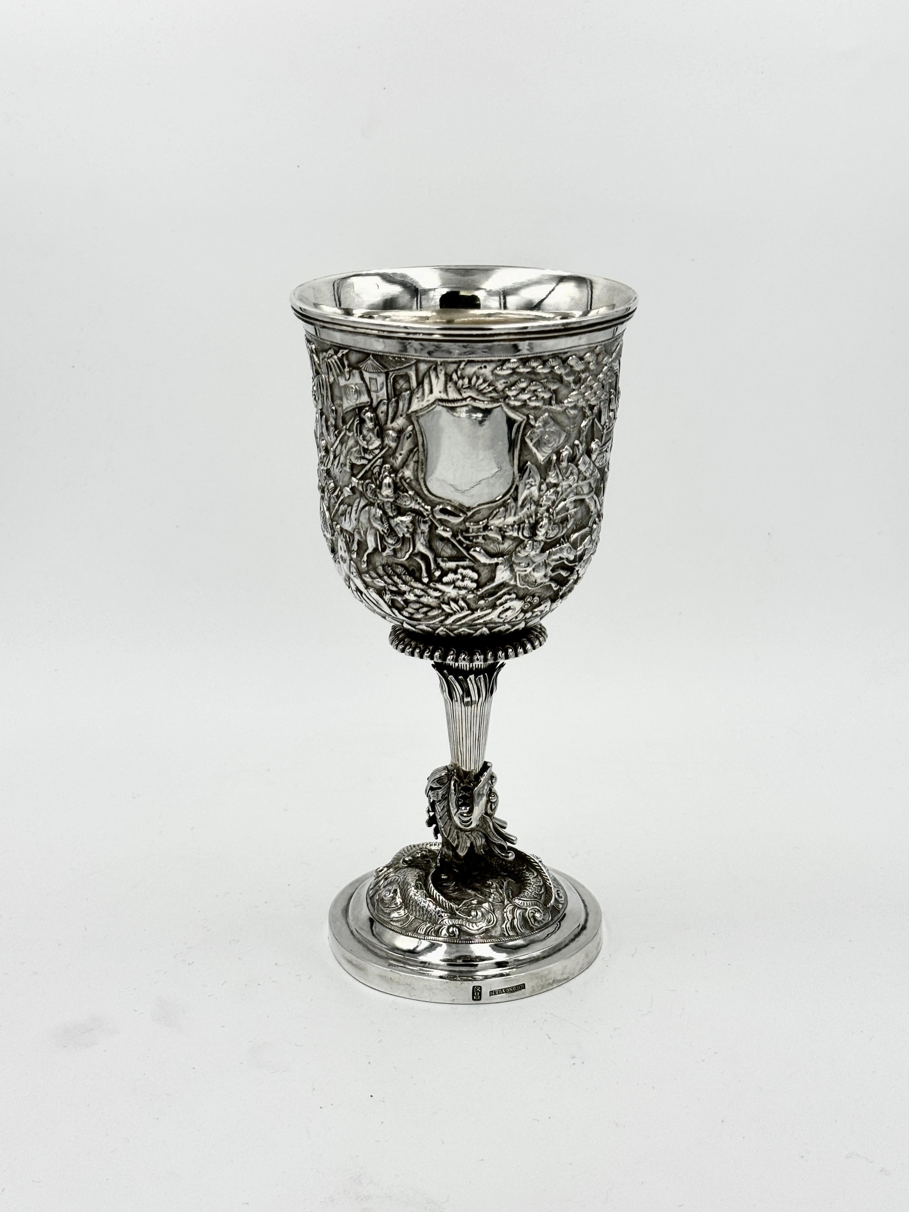 A rare Chinese Export Silver Goblet depicting the story of the Three Kingdoms. The goblet embossed and chased with characters of army of General Dian Wei (典韦) and General Lü Bu (吕布). The family name of Dian and Lü are on the flags. It has a vacant