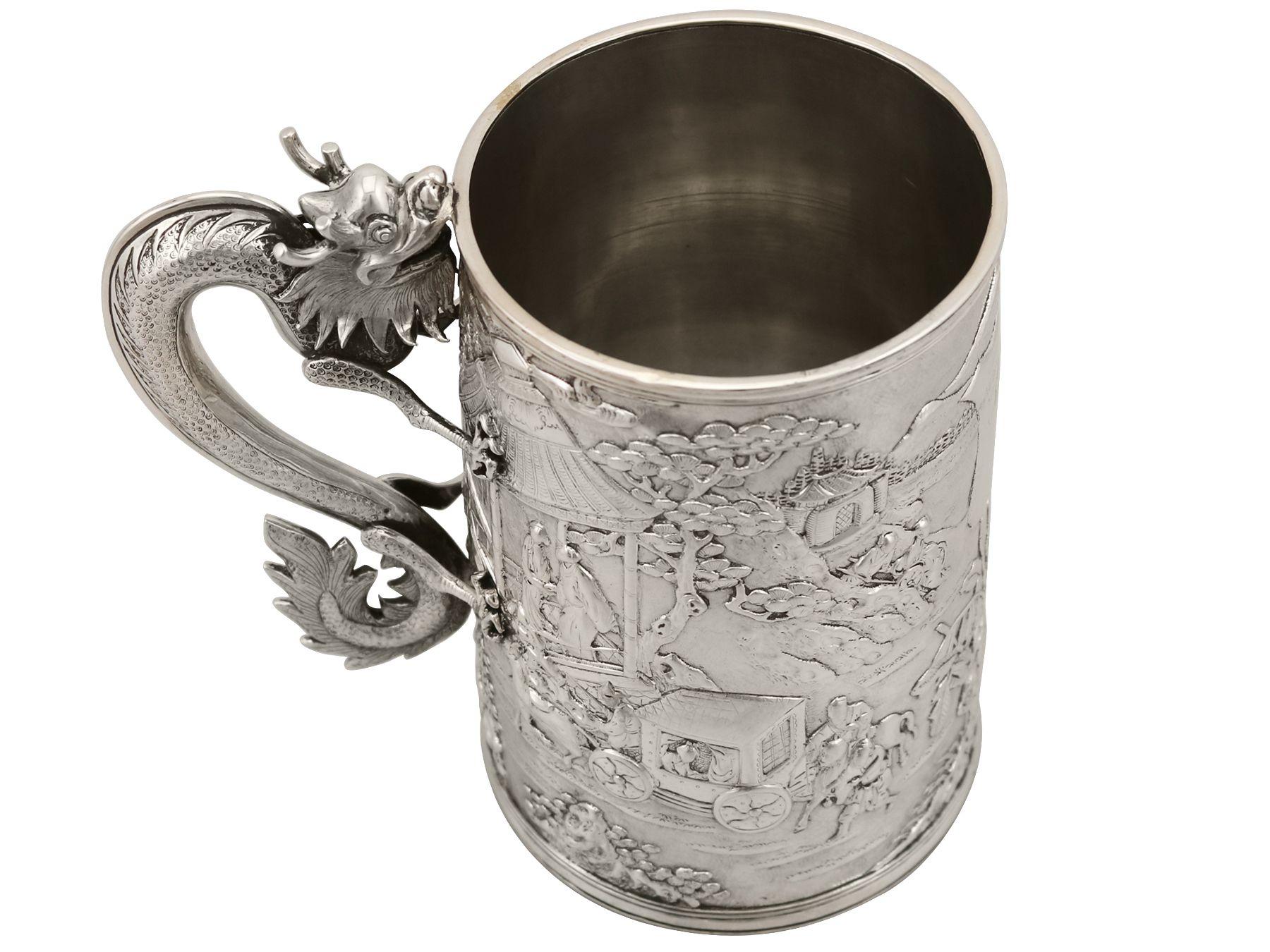 An exceptional, fine, large and impressive Chinese Export silver mug; an addition to our oriental silverware collection

This exceptional and large antique Chinese Export silver mug has a tapering cylindrical form.

The surface of this mug is