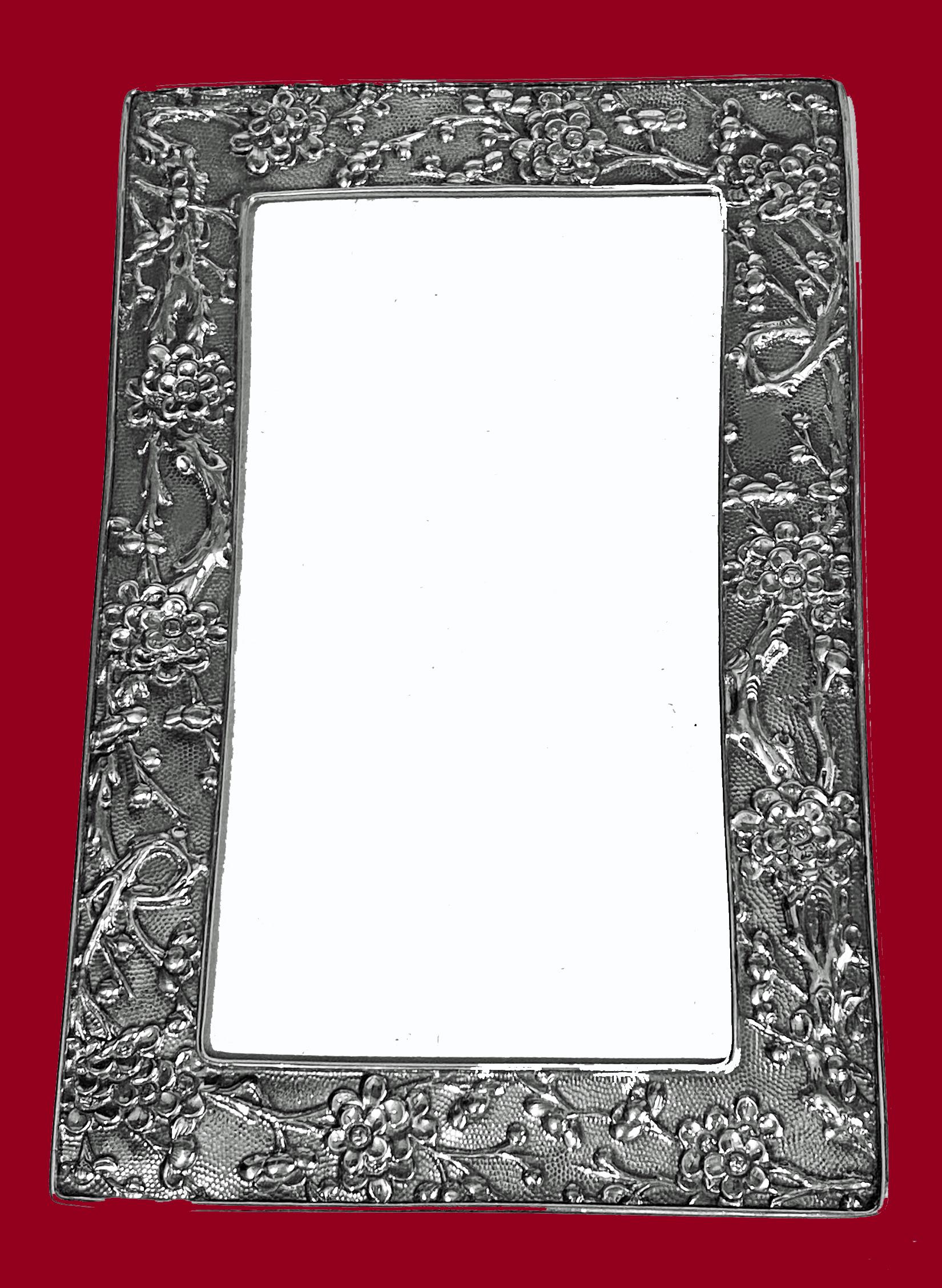Chinese Export Silver Photograph Frame Wang Hing C.1890. Rectangular shape with exquisite foliage relief motif on matte stippled background. Original easel to reverse and marked with both Chinese marks for Wang Hing and WH90. Overall measurements: