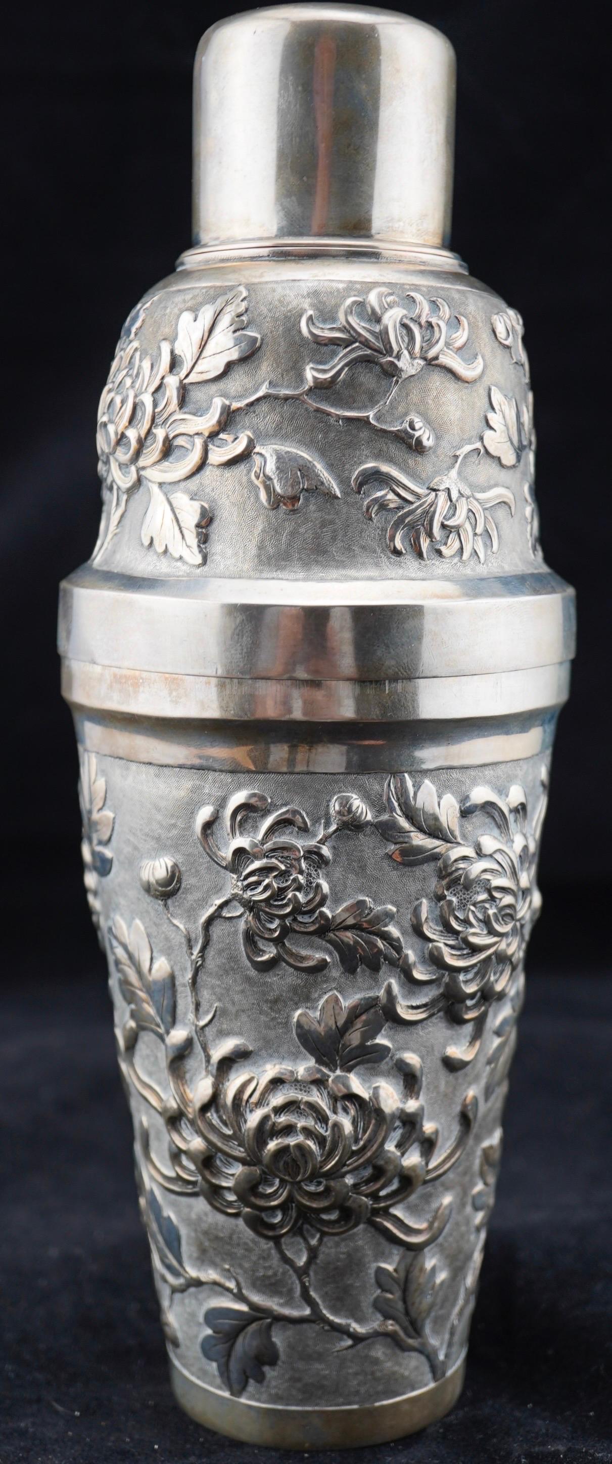 Chinese export silver repousse cocktail shaker with chr.ythanthemum decoration. Marked for 