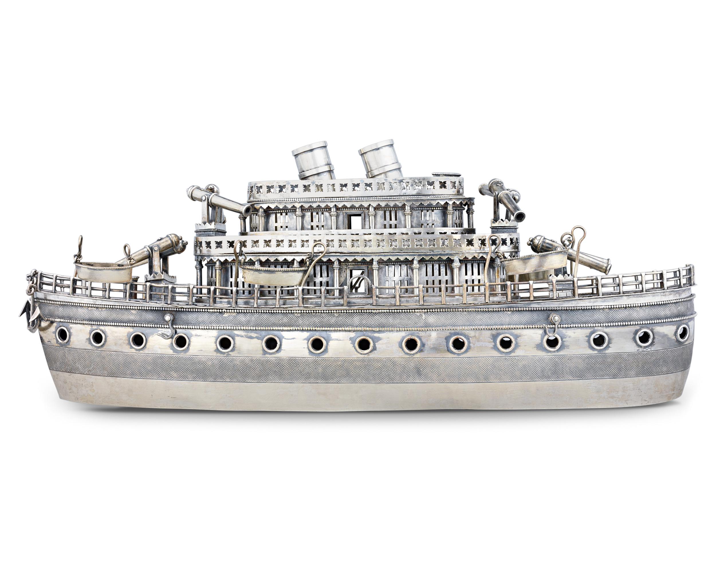 This delightful and exceptionally rare steamboat centerpiece exemplifies the remarkable artistry of Chinese export silver. Chinese silver pieces are renowned for their exceptional quality and unique designs, and the majority are entirely