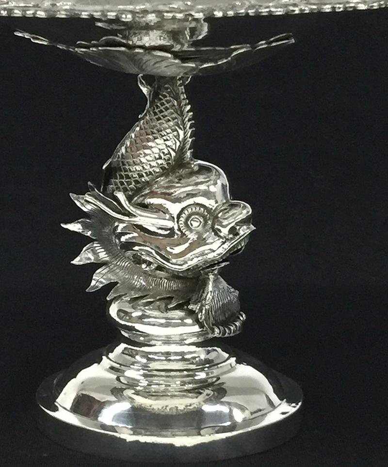 Chinese Silver Tazza by Tien Shing, Hong Kong, 19th Century

Chinese export silver Tazza , marked by the Chinese silversmith Tien Shing, Hong Kong, (1830-1900), The Tazza is made in the 19th century. The circular dish raised on a figural fish,