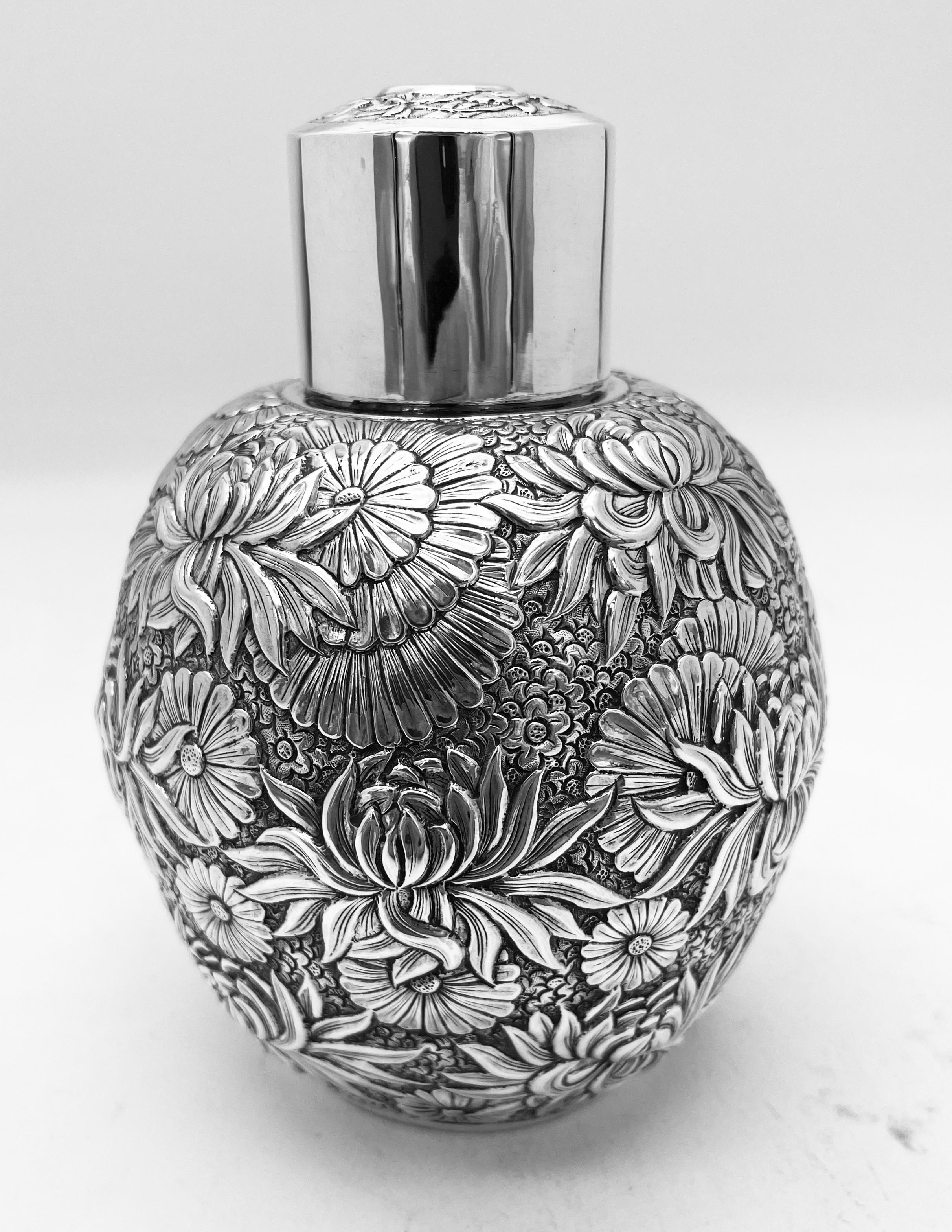 A Chinese Export Silver Tea Caddy chased and embossed all over with chrysanthemum, circa 1890. The jar was retailed by HC (Hung Chong). Hung Chong was located in Shanghai and Canton, and was one of the first and longest-lasting Cantonese western