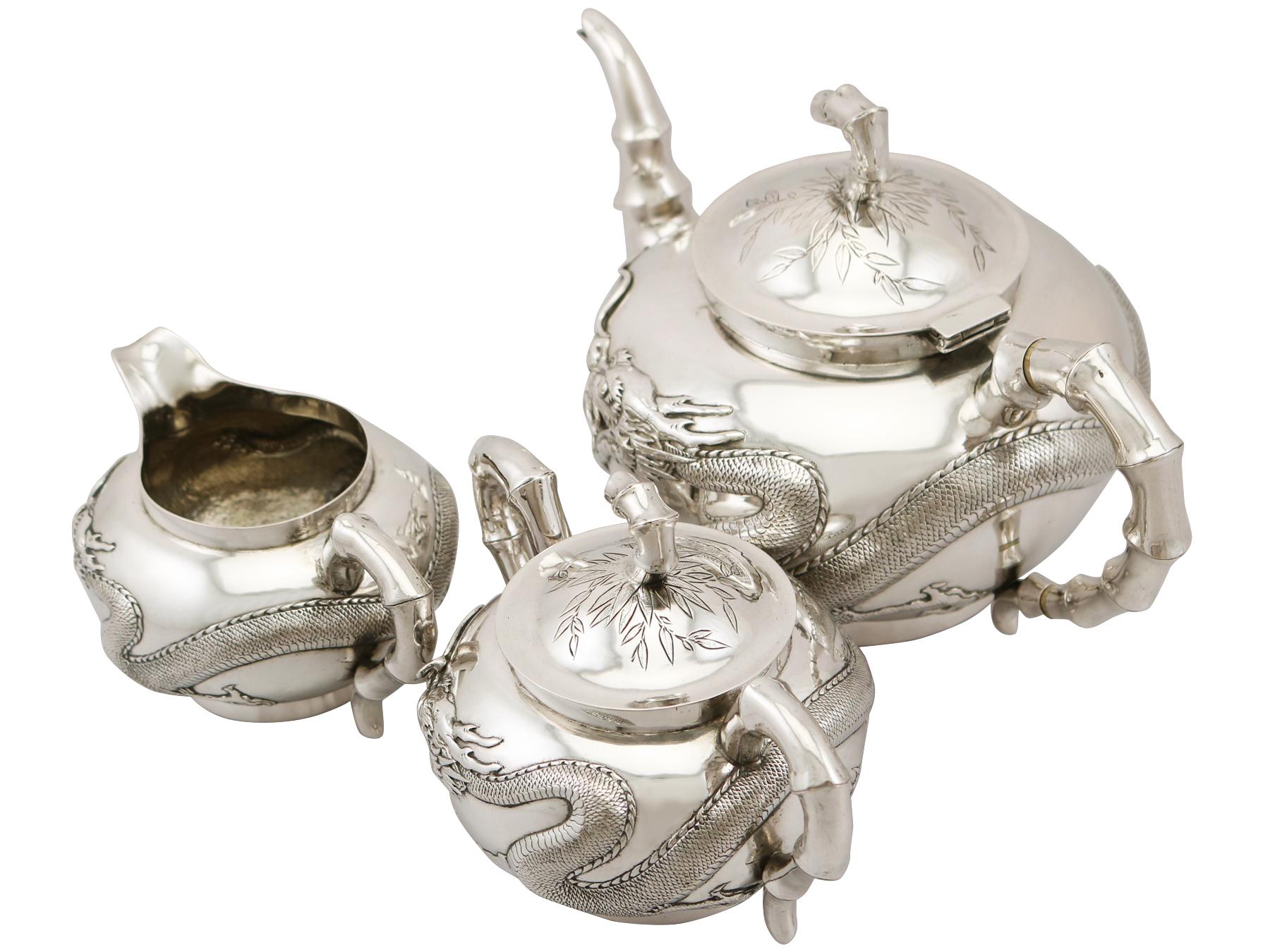 An exceptional, fine and impressive antique Chinese export silver three piece tea service; an addition to our diverse silver teaware collection.

This exceptional antique Chinese silver tea set/service consists of a teapot, cream jug and sugar
