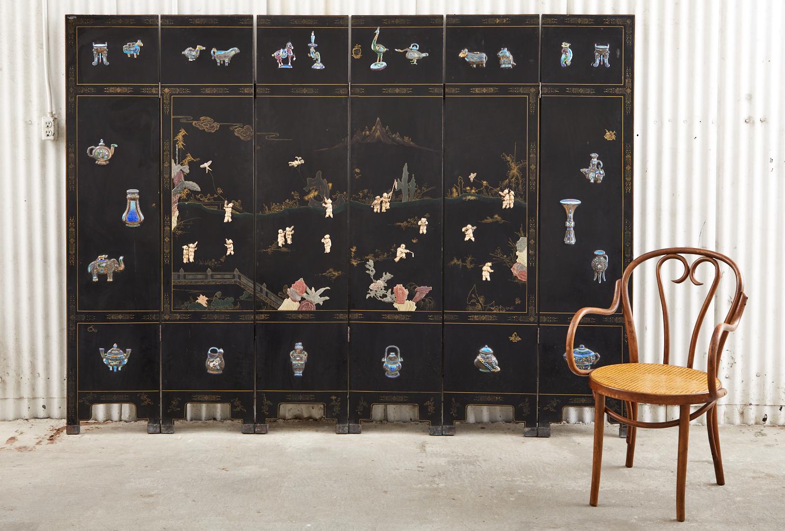 Charming Chinese export six-panel lacquer coromandel screen featuring a blue and white cloisonné style border decorated with scholars objects, animals, and vases. The middle of the screen has a fertility motif and depicts 16 young boys engaged in