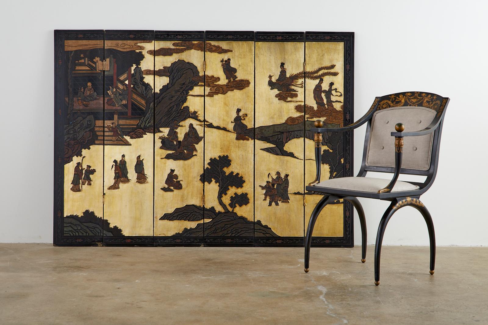 Fascinating Chinese export six-panel coromandel screen featuring mythical figures of 8 immortals, 3 star gods, and xiwangmu. The scene has a dramatic gold leaf style background of gilt. The reverse side of the screen has a sparse bamboo landscape