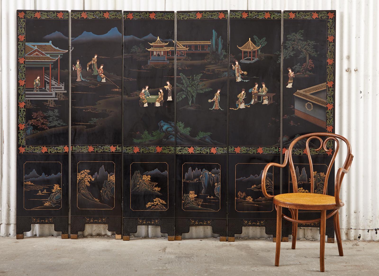Colorful Chinese export six-panel lacquered folding Coromandel screen featuring a pagoda courtyard with beauties. The panels are covered with layers of thick black lacquer and intricately incised. The lightly carved, painted scenes of an idyllic