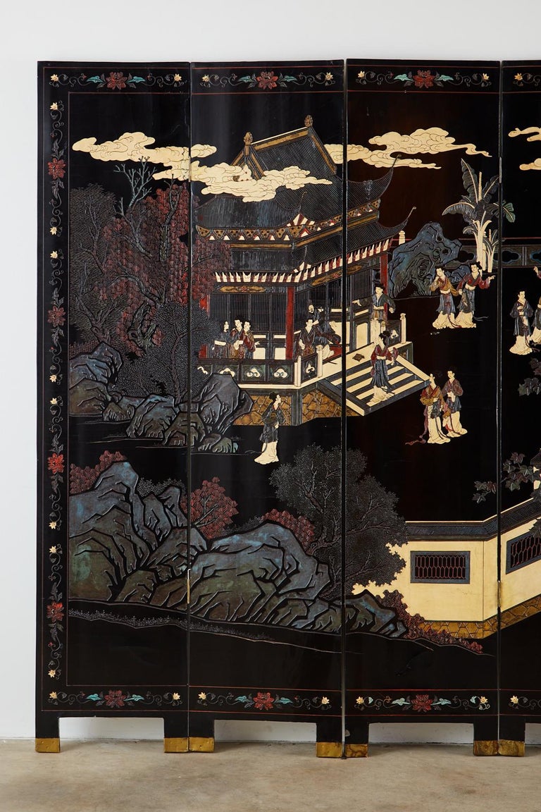 Mid-20th century Chinese export six-panel Coromandel screen depicting a beautiful walled pavilion with pagodas. Handcrafted, carved layers of lacquered wood are painted with vivid colors including rarely seen white. The scene has figures enjoying