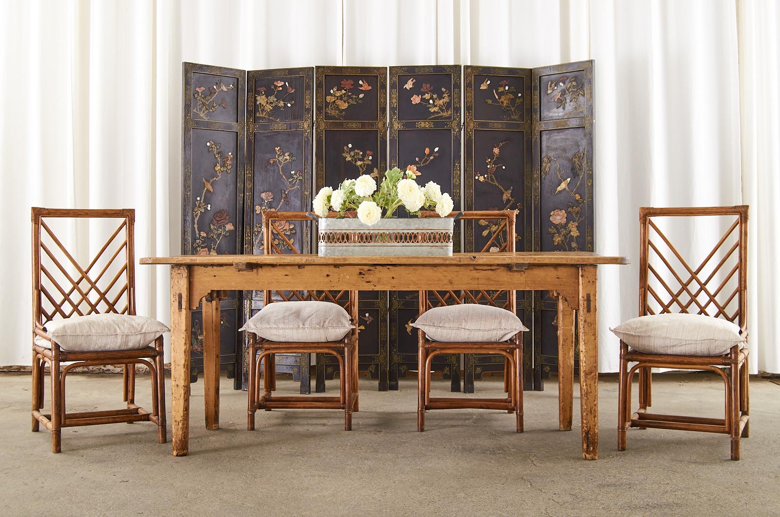 Spectacular Chinese export six-panel lacquered coromandel screen featuring hand-carved soapstone flora and fauna decorated panels. The screen has three inset windows on each panel with parcel gilt borders framing the dramatic scenes. The vivid