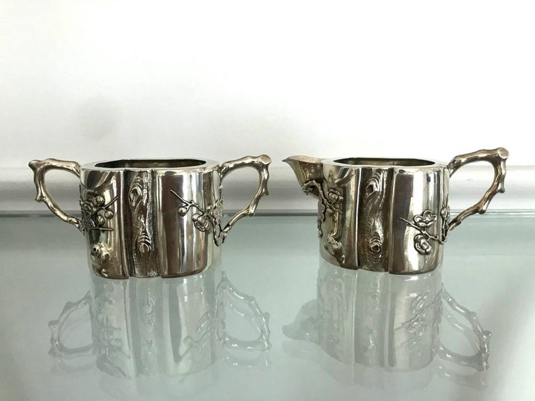 A two-piece set sterling silver creamer and sugar made signed 